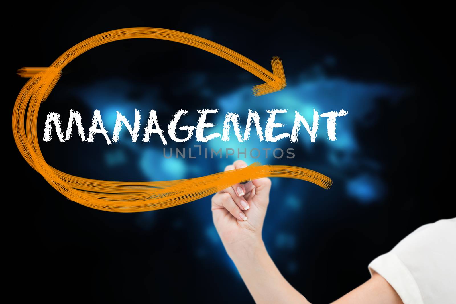 Businesswoman writing the word management by Wavebreakmedia