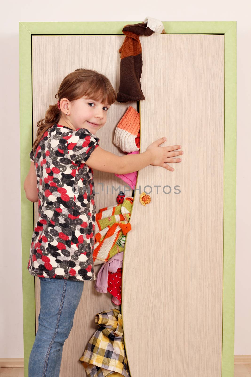 panic little girl trying to close the closet  by goce