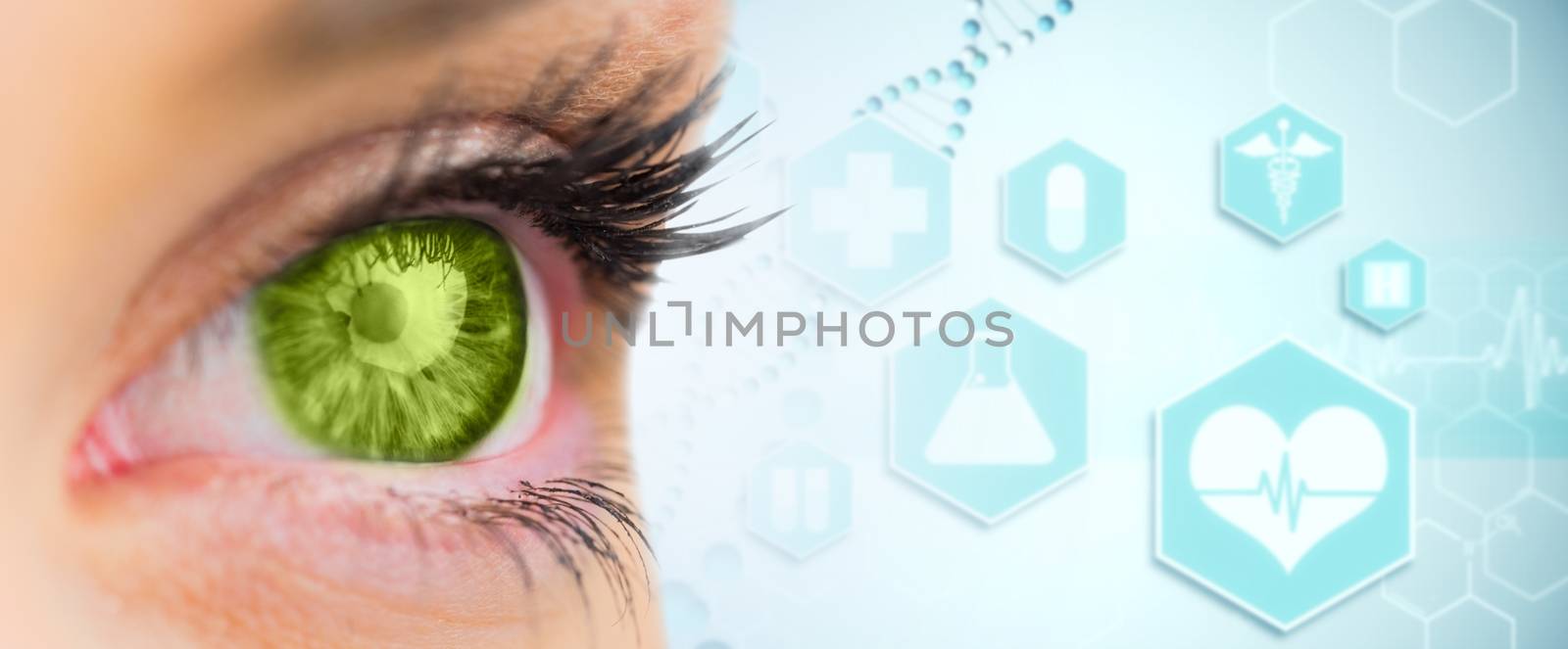 Composite image of green eye looking ahead by Wavebreakmedia