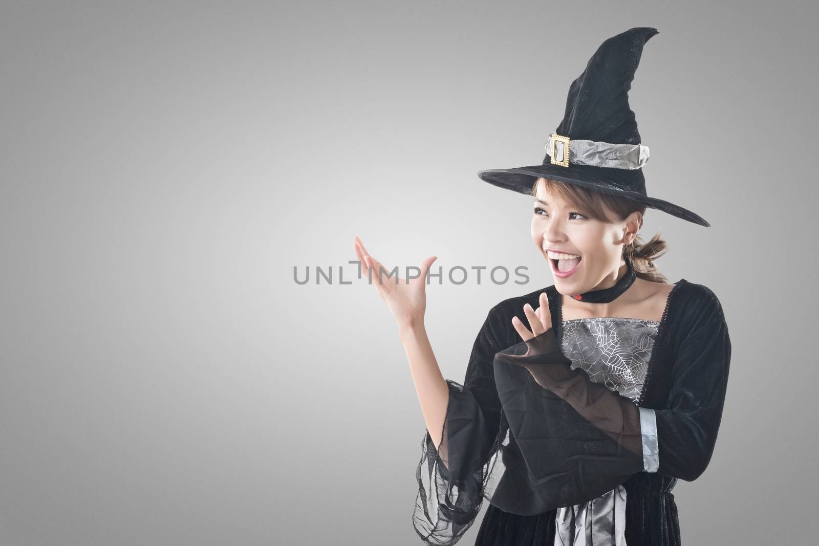 Asian witch woman using magic, closeup portrait with copyspace.