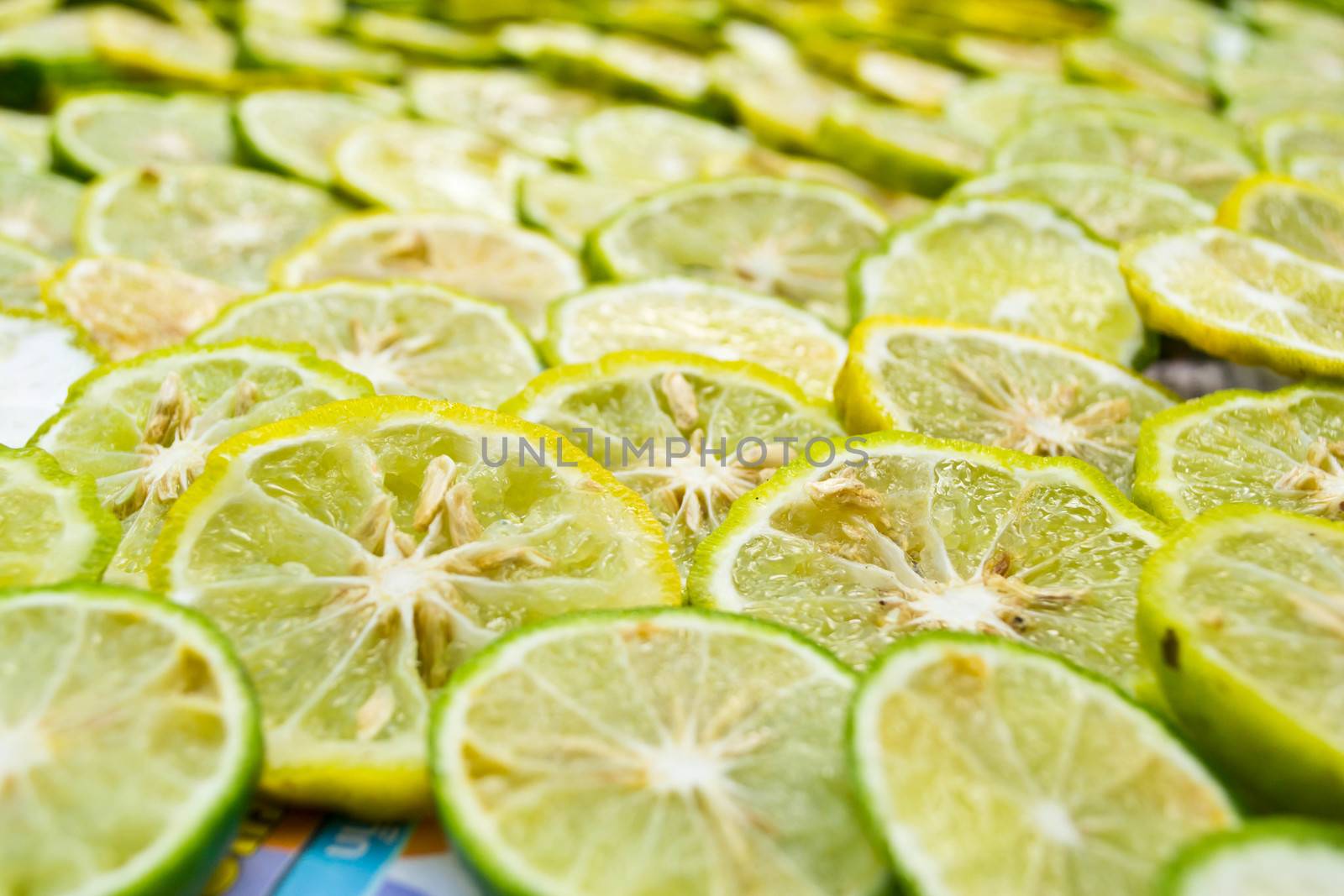 Close-up of fruit lemon slices by Thanamat