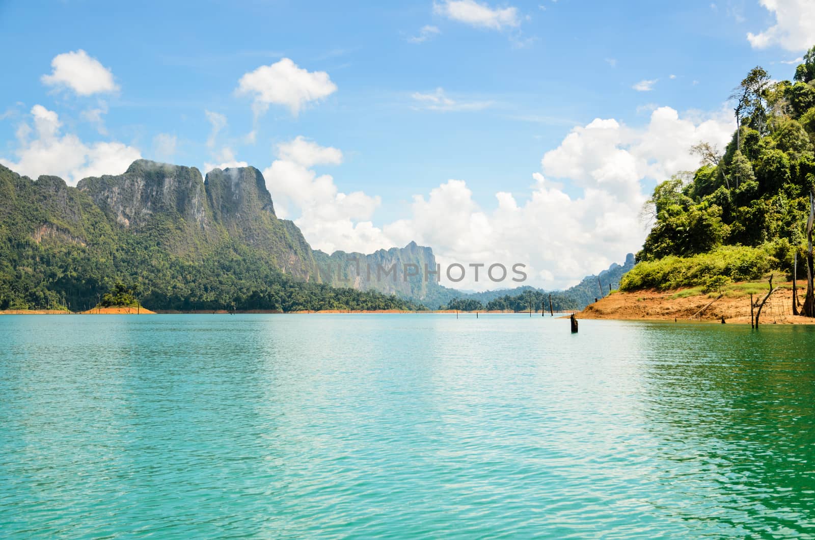 High mountain range above the green lake at Ratchapapha dam in Khao Sok National Park, Surat Thani province, Guilin of Thailand.