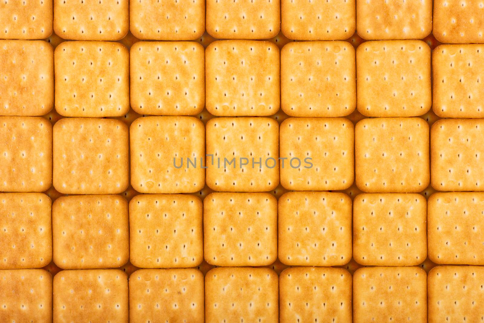 Background of crackers lined in neat rows