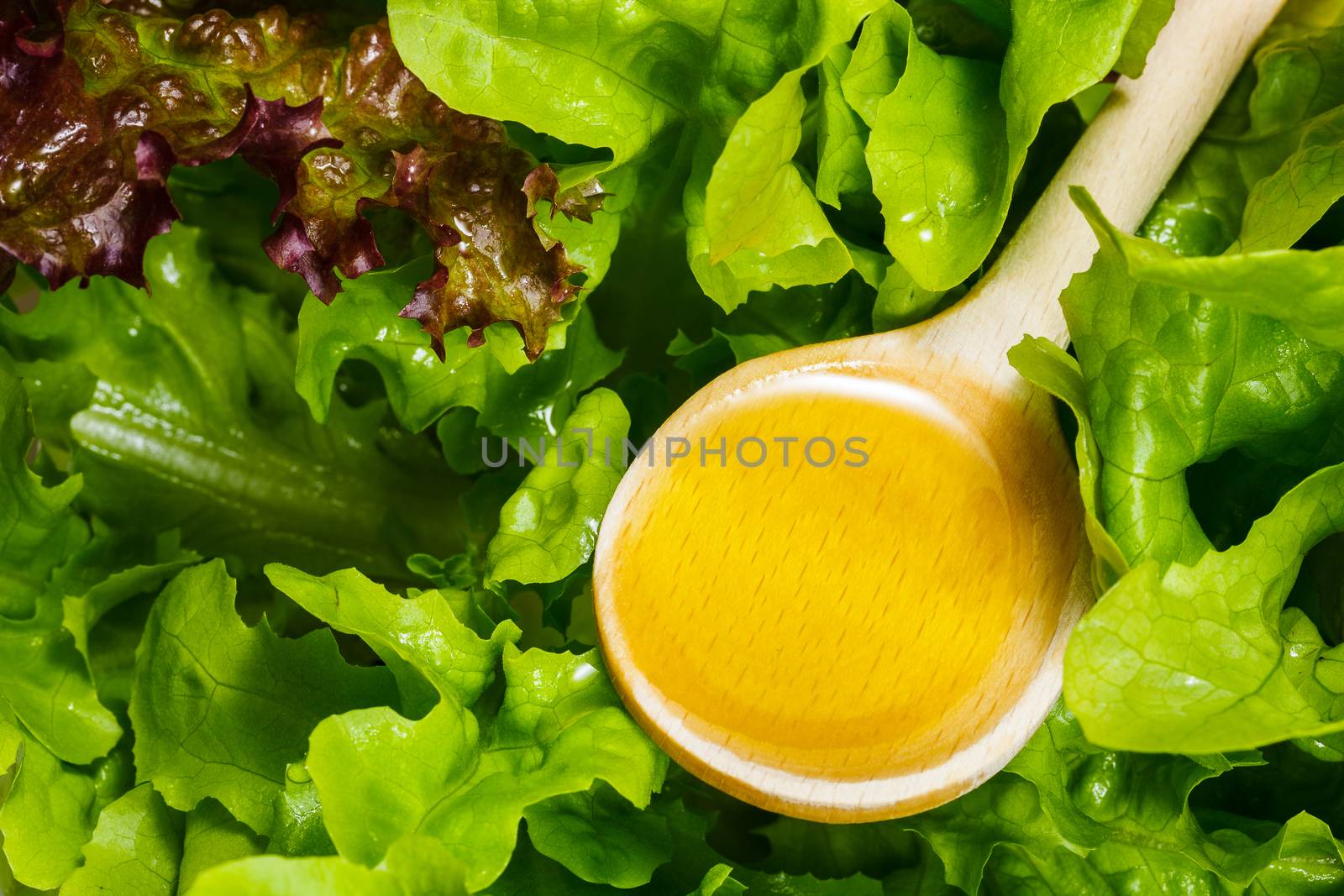 Salad with olive oil. Preparing food concept