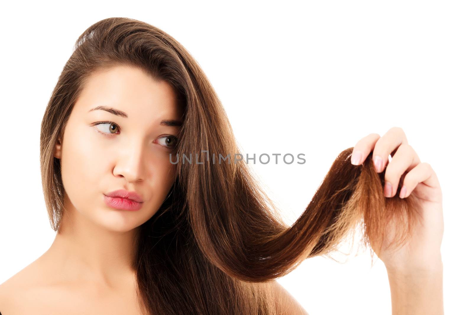 woman is not happy with her fragile hair, white background by Nobilior