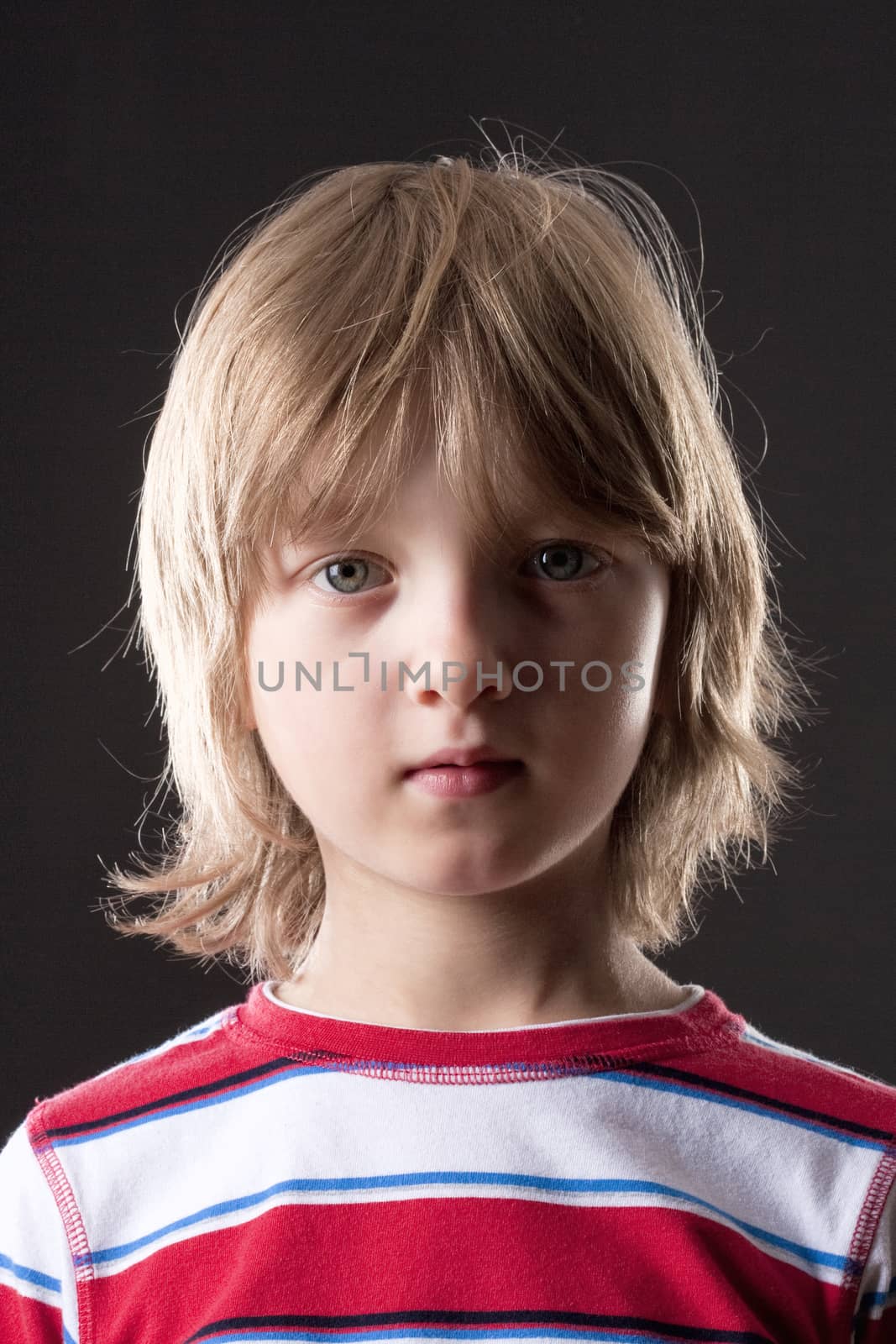 Portrait of a Boy with Blond Hair Looking