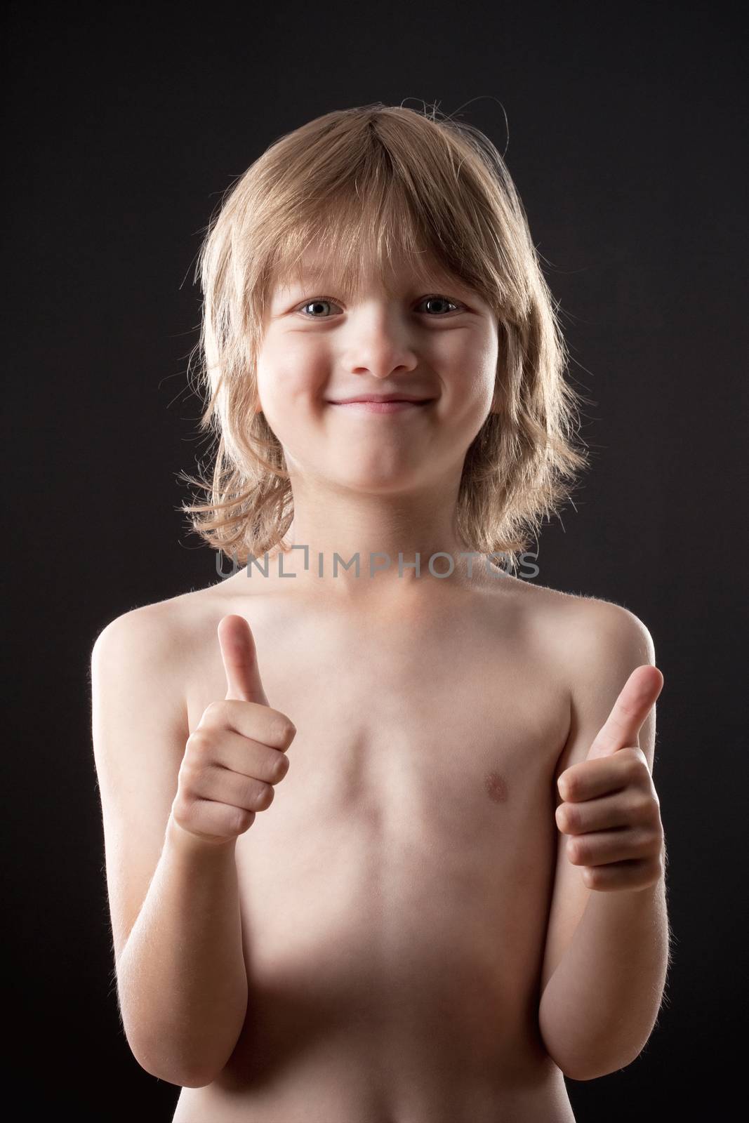 Boy with Blond Hair Showing Thumbs Up by courtyardpix