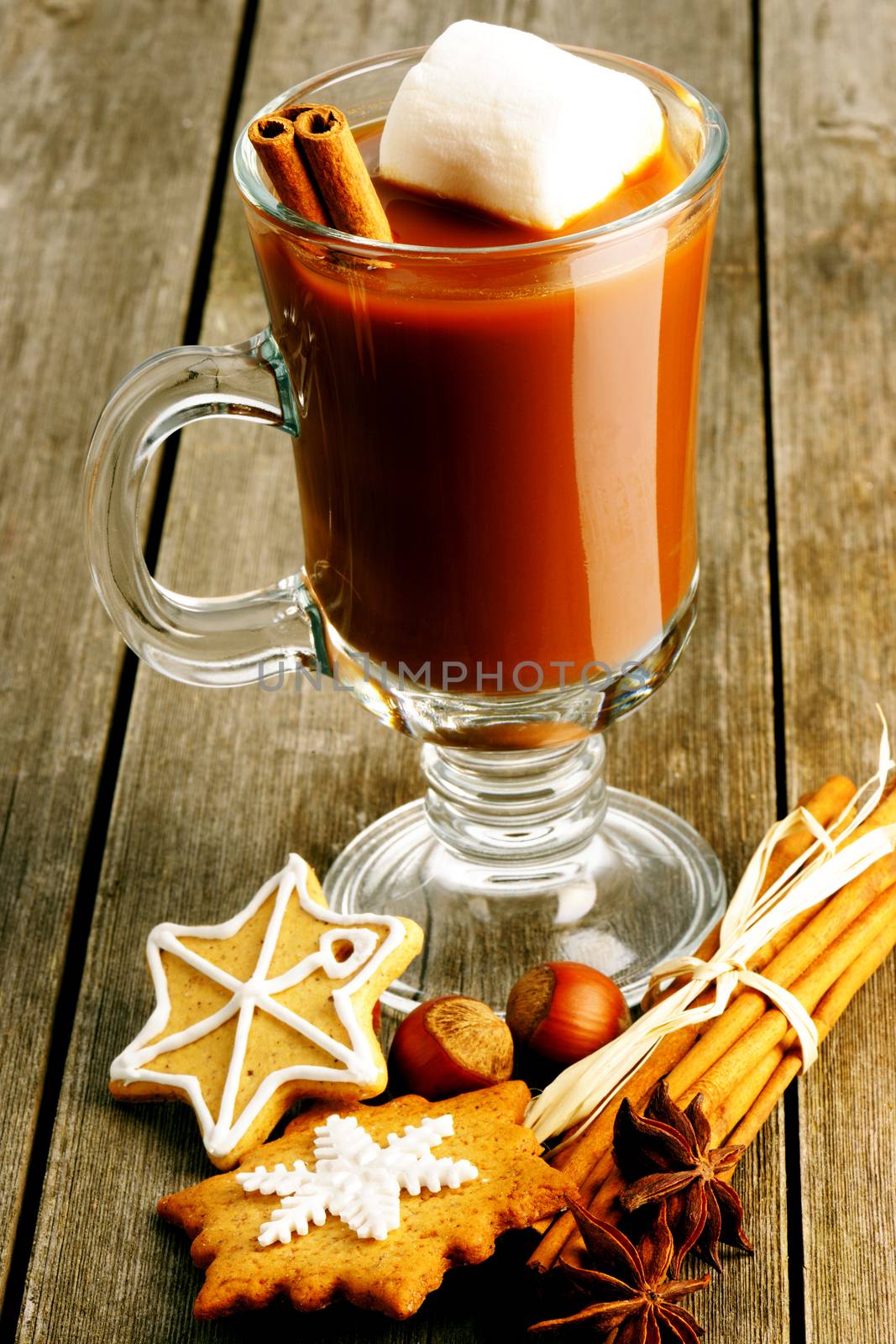 Glass of hot chocolate on wooden table