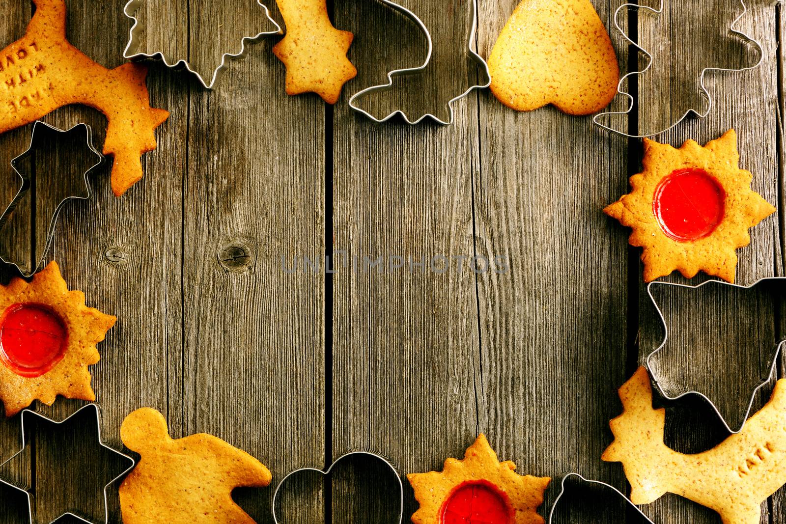 Christmas homemade gingerbread cookies over wooden table