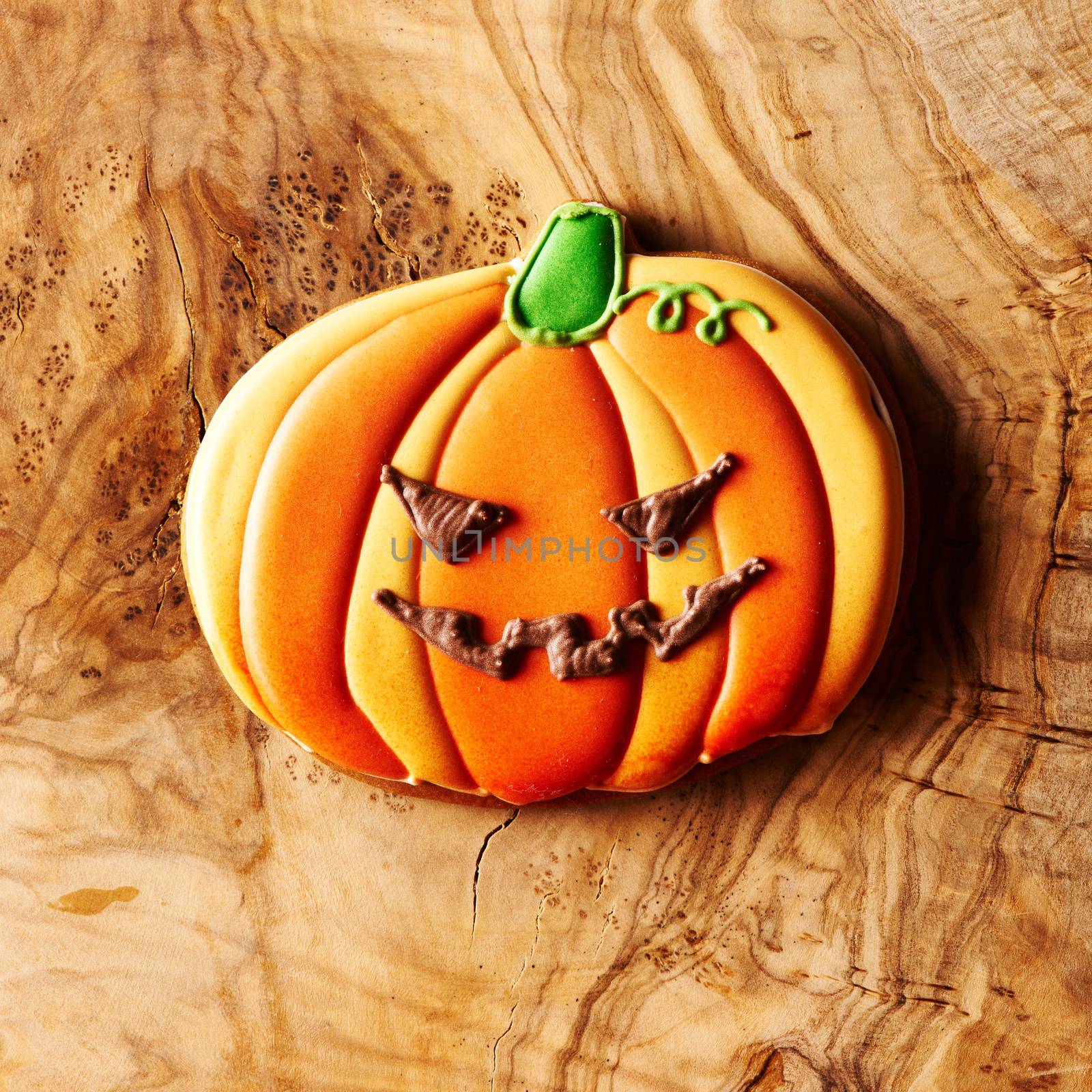 Halloween homemade gingerbread cookie over wooden table