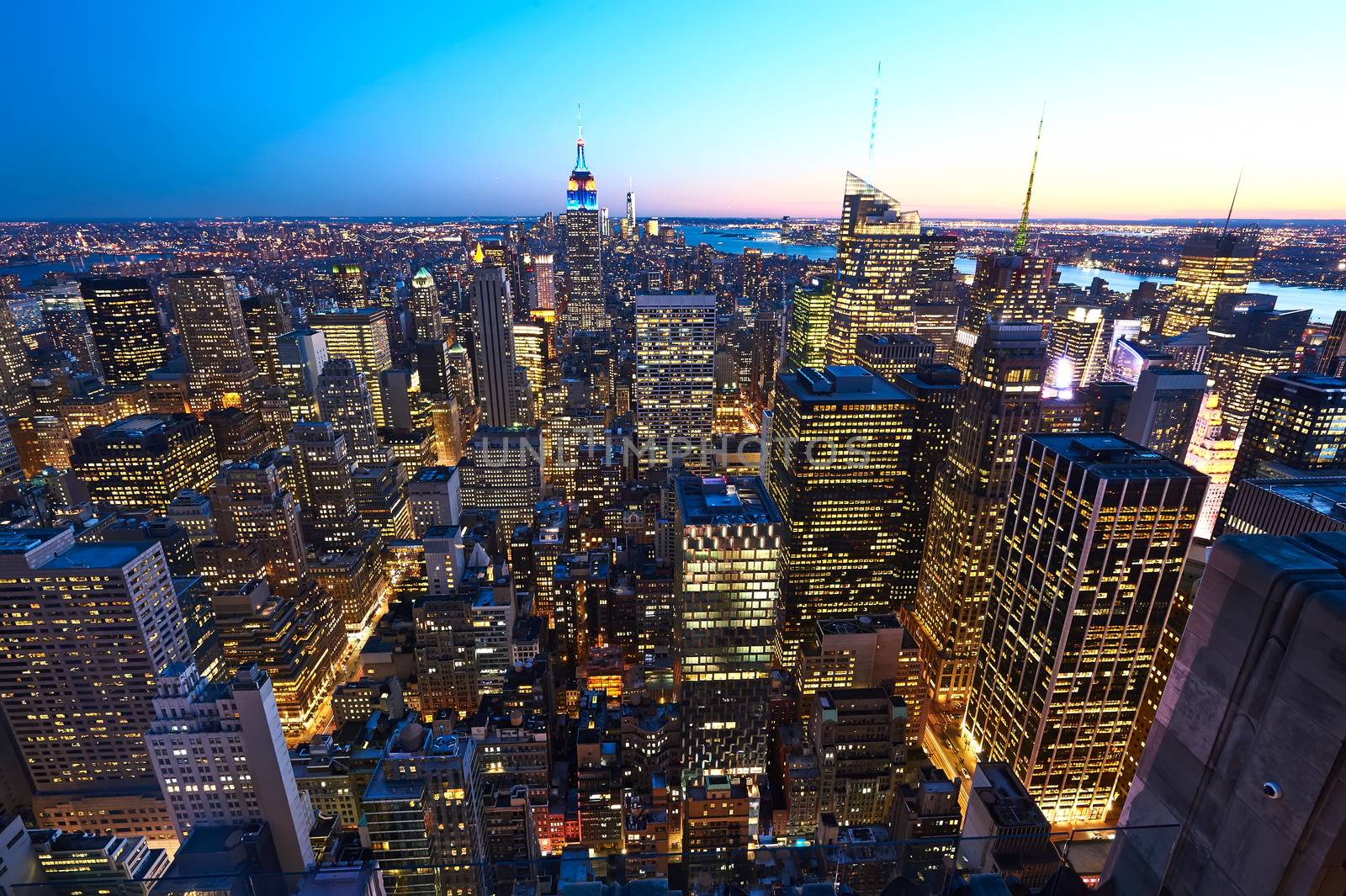 Cityscape view of Manhattan with Empire State Building at night by haveseen