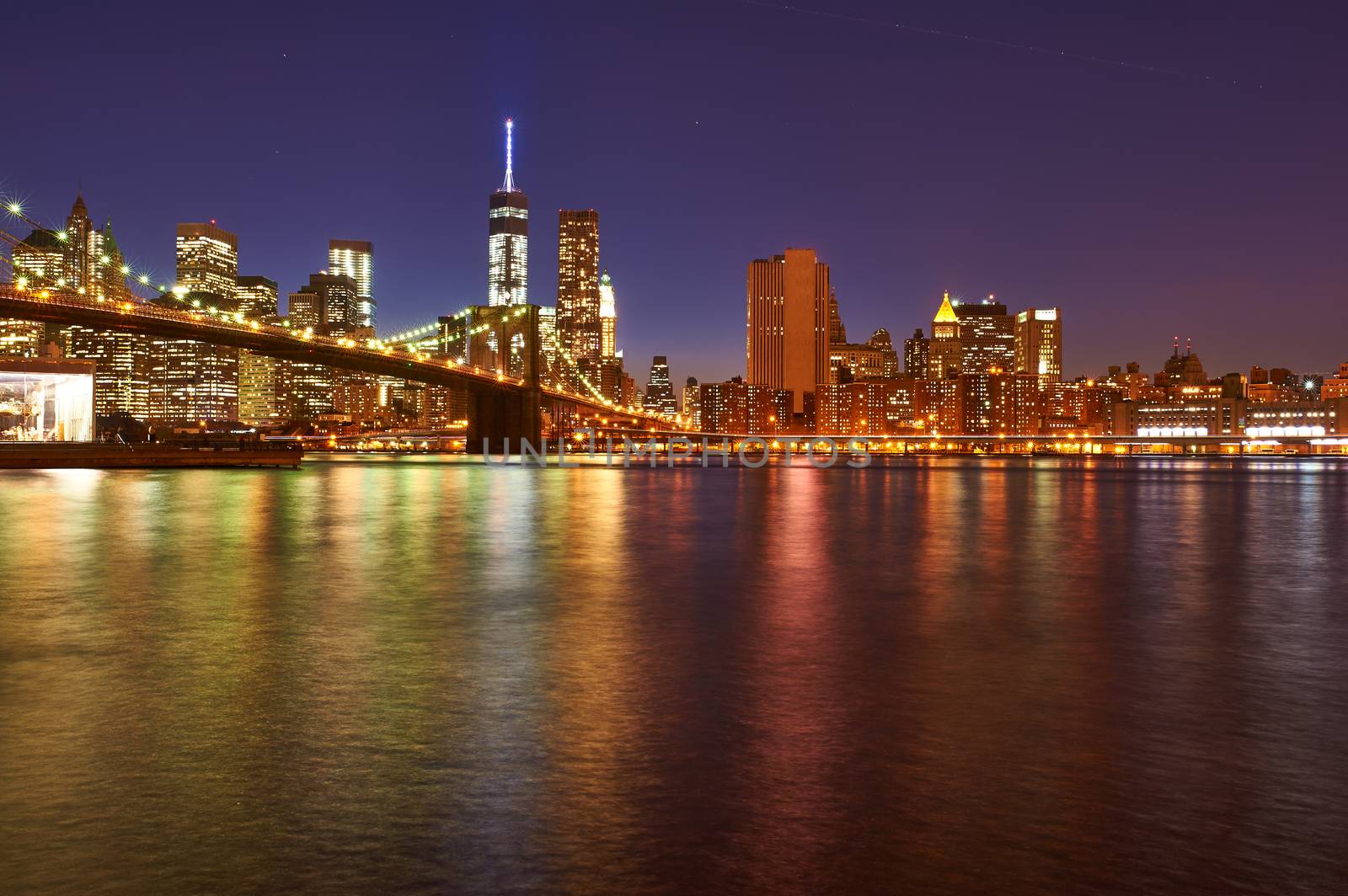 Brooklyn Bridge with lower Manhattan skyline in New York City at night