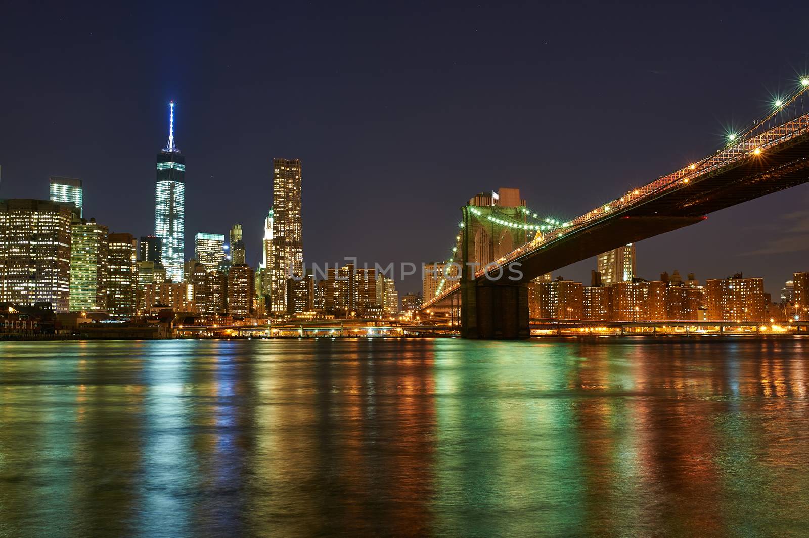 Brooklyn Bridge with lower Manhattan skyline at night by haveseen