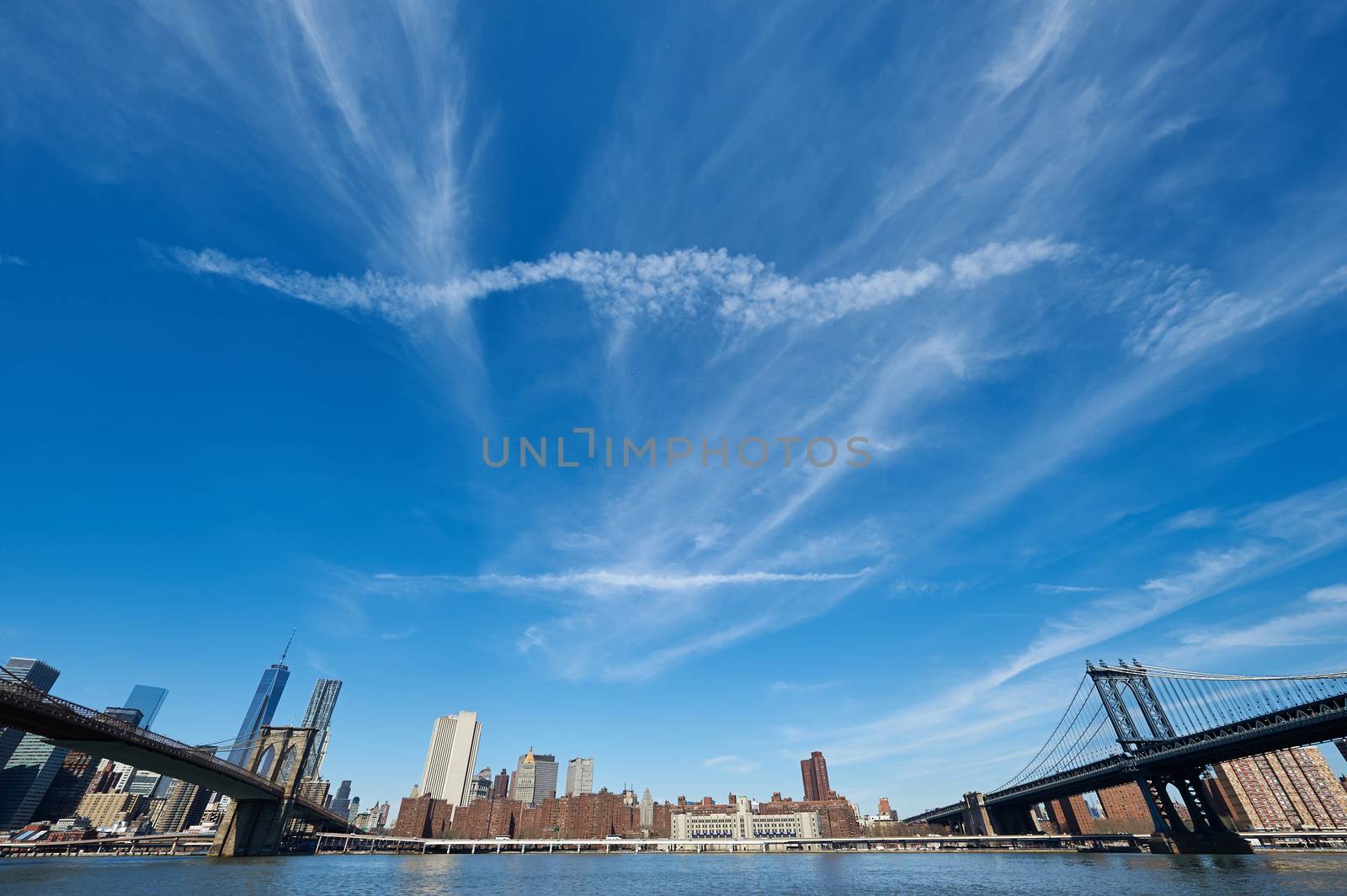 Manhattan skyline view from Brooklyn between Brooklyn Bridge and Manhattan Bridge in New York City