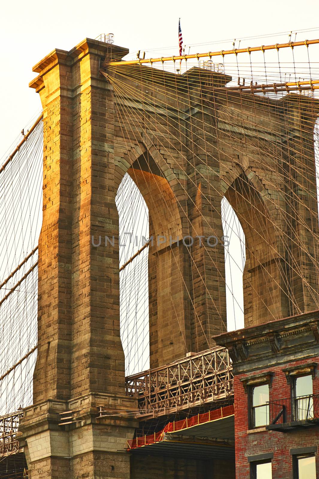 Close up of a pillar of the Brooklyn bridge at sunset by haveseen