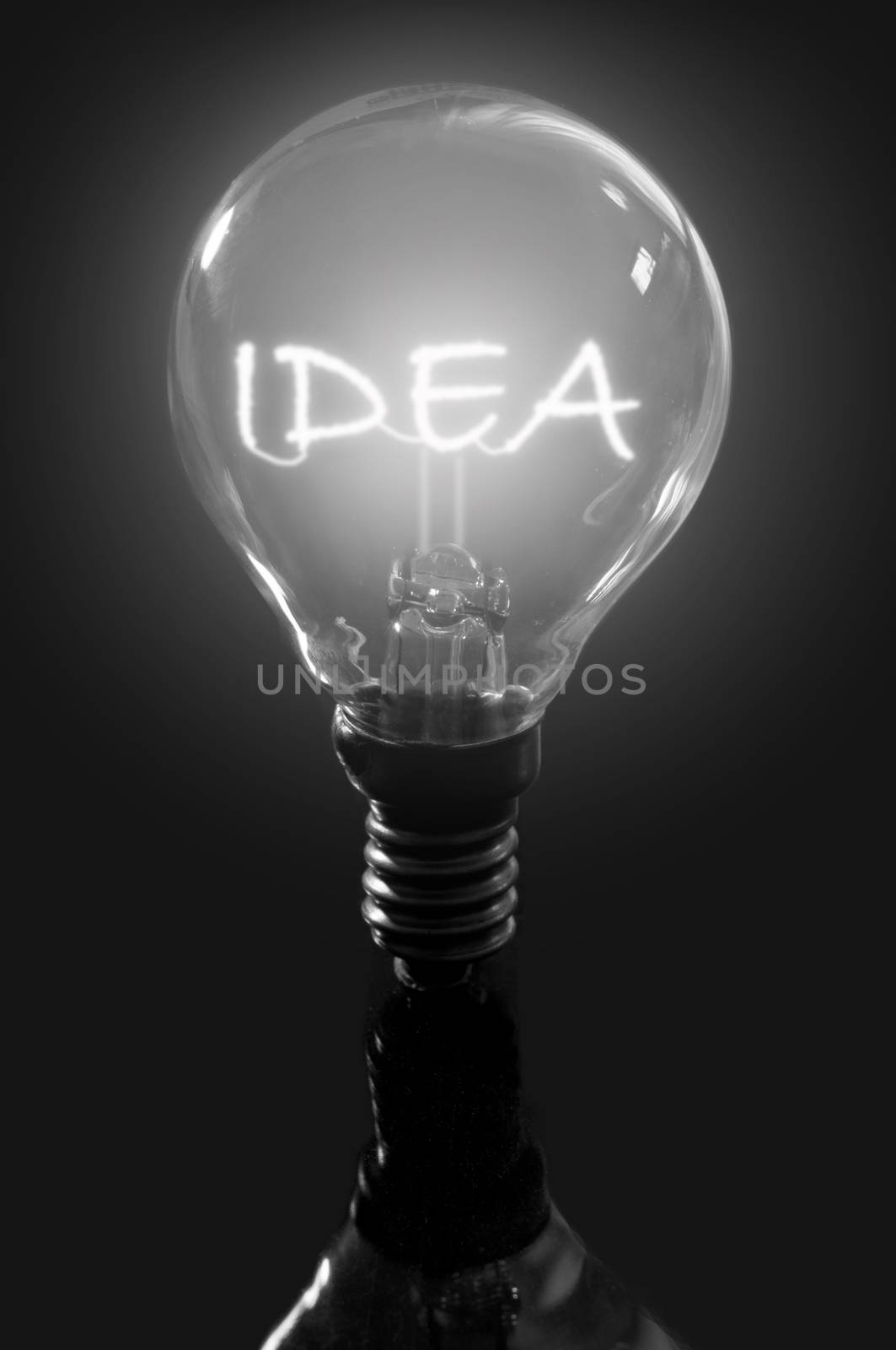 Illuminated idea sign inside a light bulb