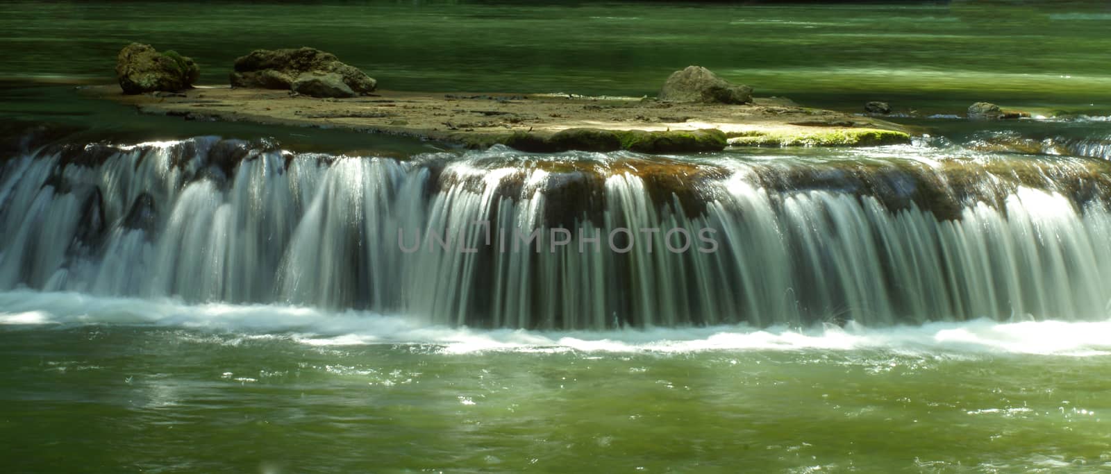 The small waterfall and rocks in National Park, Thailand.