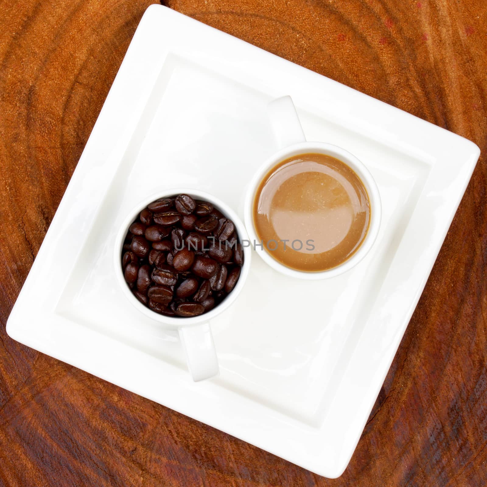 Coffee and beans on the wooden background.