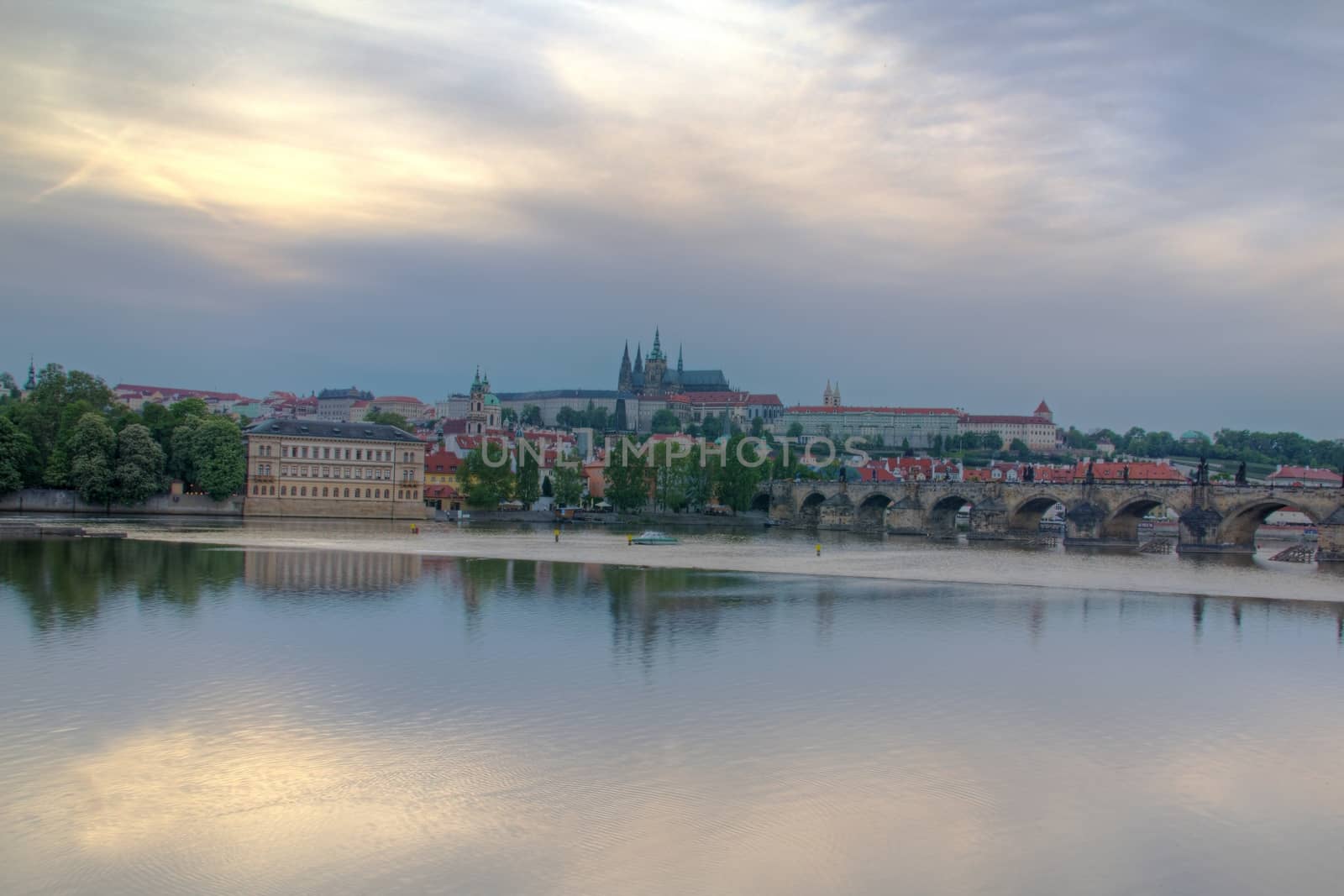 Photo shows general view of Prague castle and Vltava river.