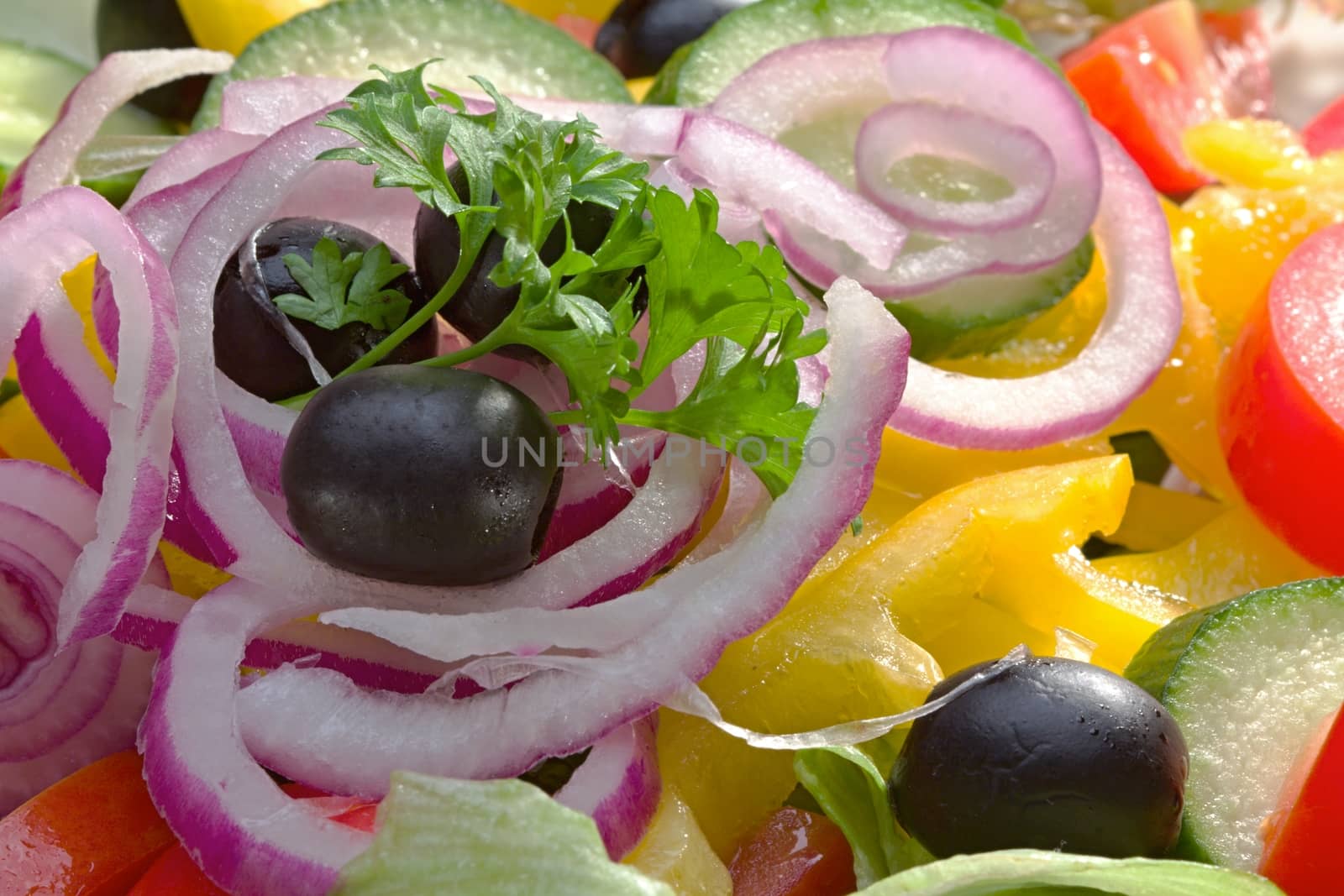 Photo shows details of various vegetable salad ingredients.