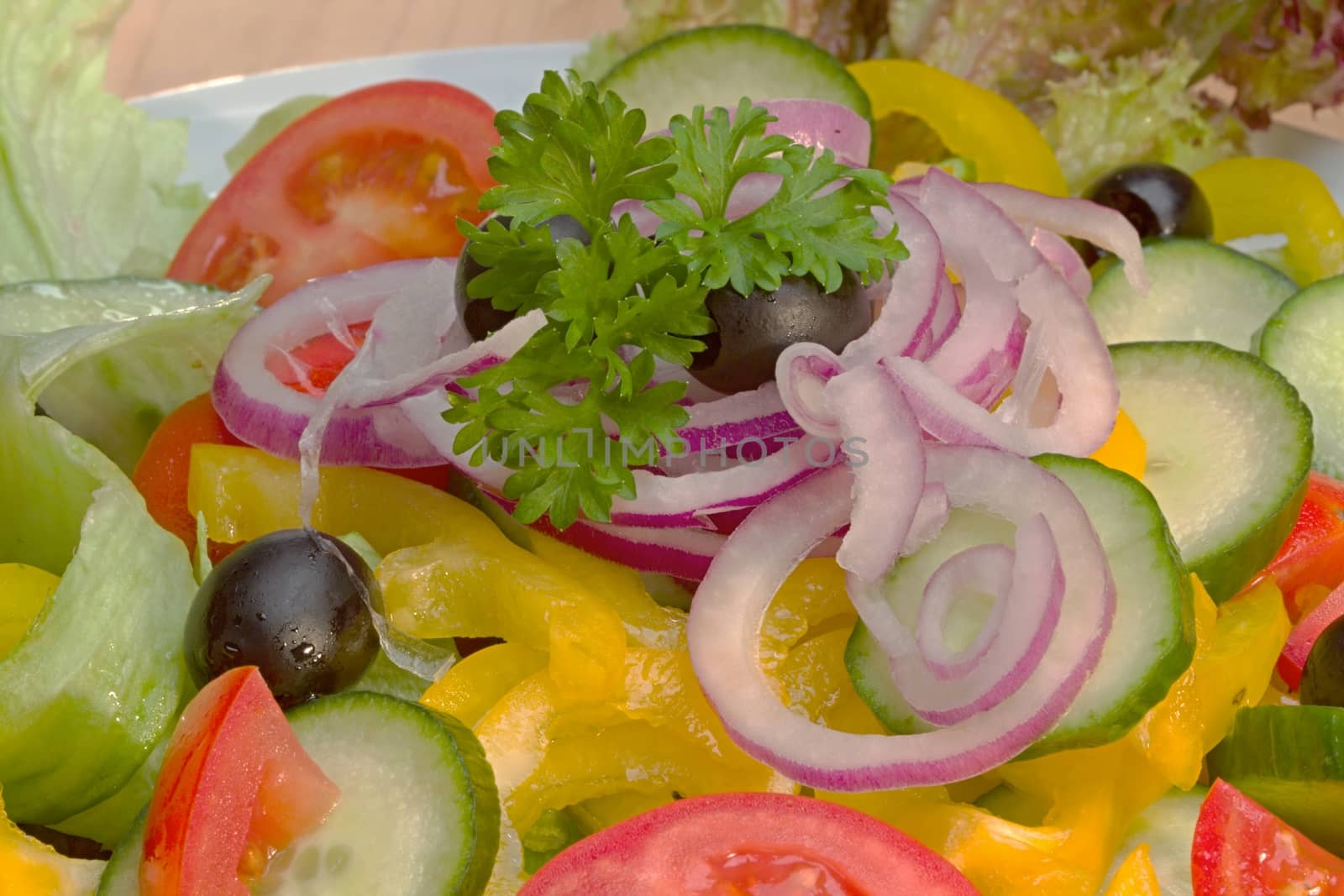 Photo shows details of various vegetable salad ingredients.