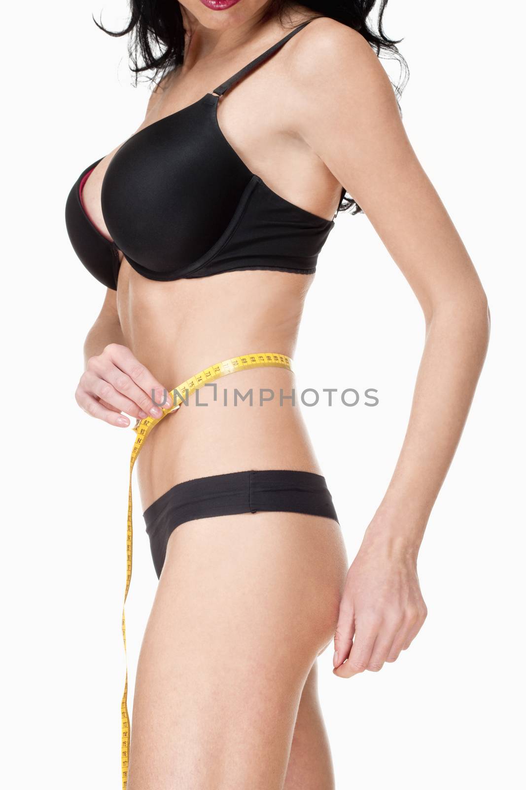 Woman in Black Underwear Measuring Results of Diet - Isolated on White