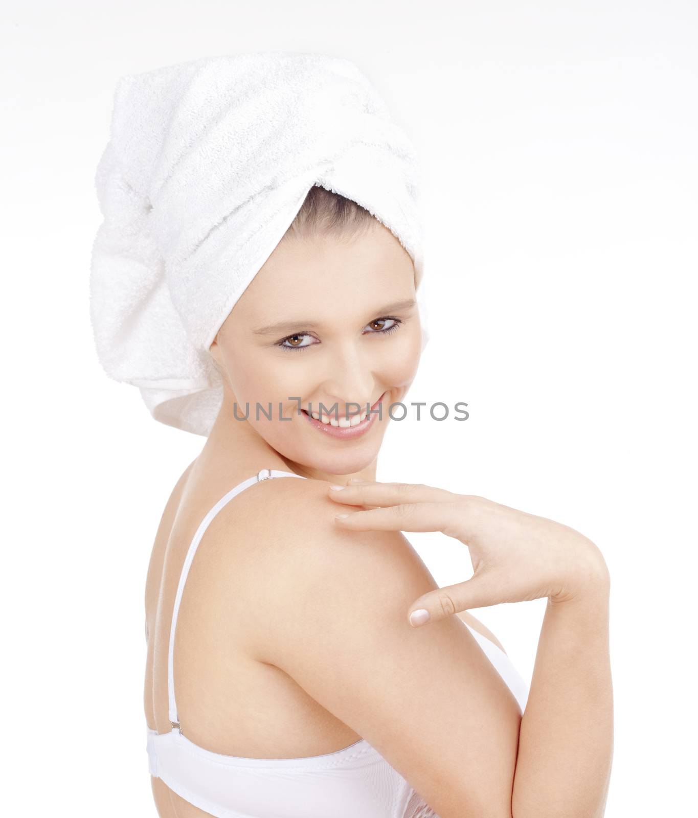 Beautiful Young Woman with Towel on her Head Smiling - Isolated on White