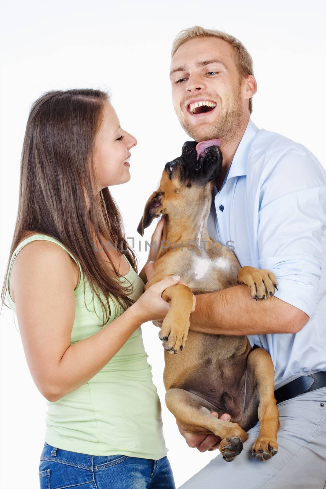 Portrait of a Happy Young Couple with a Dog. by courtyardpix