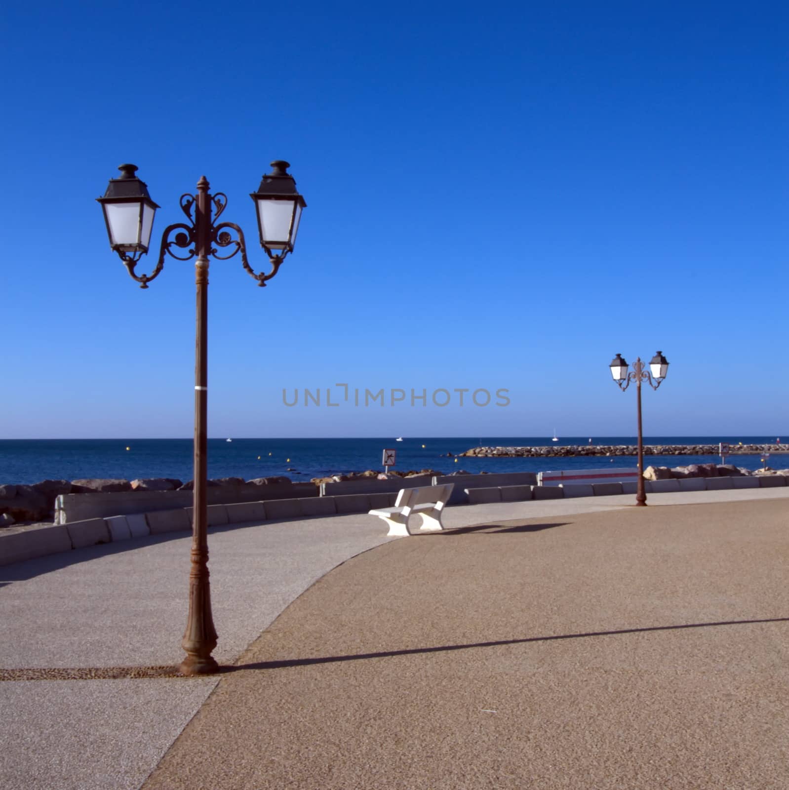 Promenade near the sea, Saintes-Maries-de-la-mer, France by Elenaphotos21