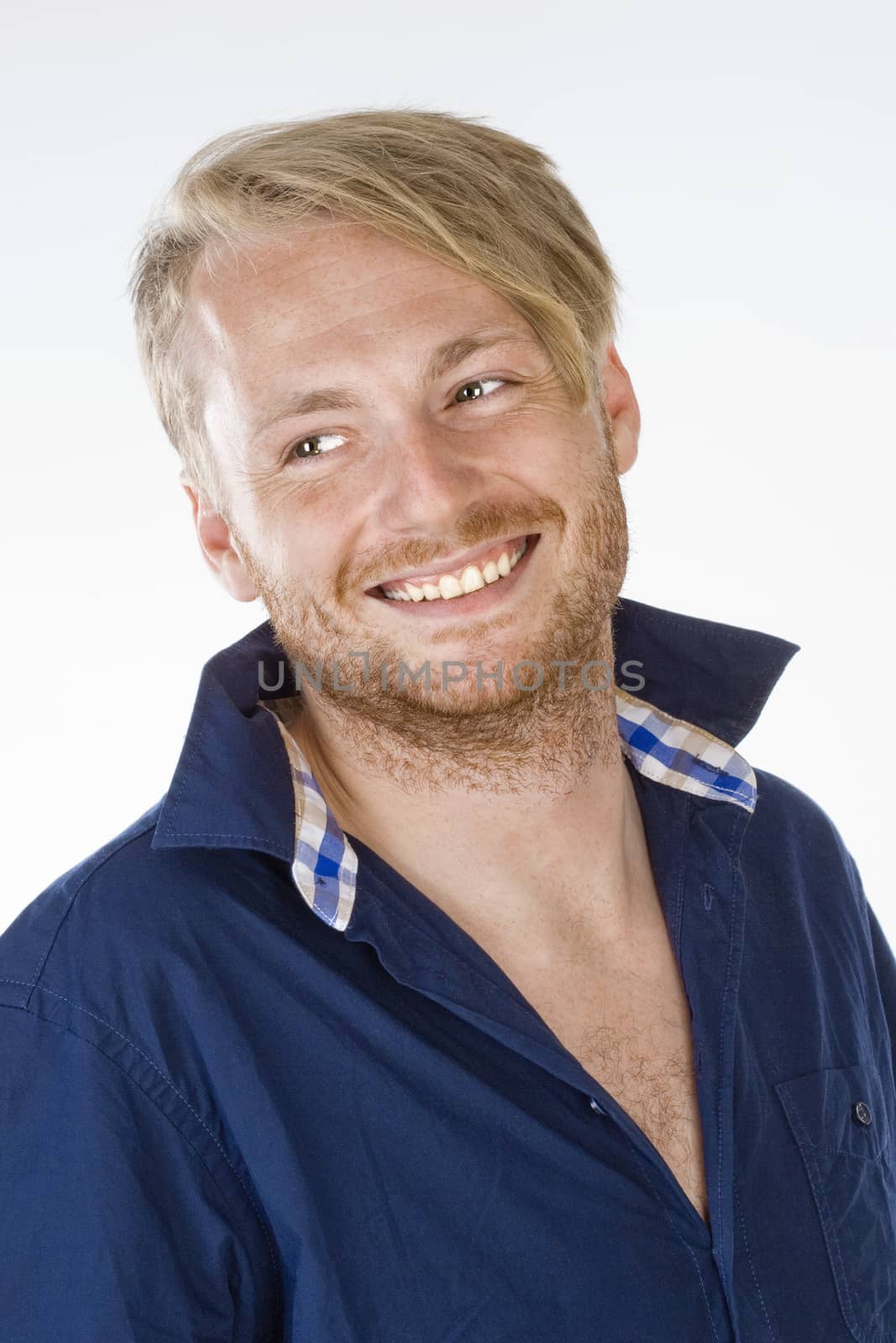 Portrait of a Young Man Smiling - Isolated on Gray