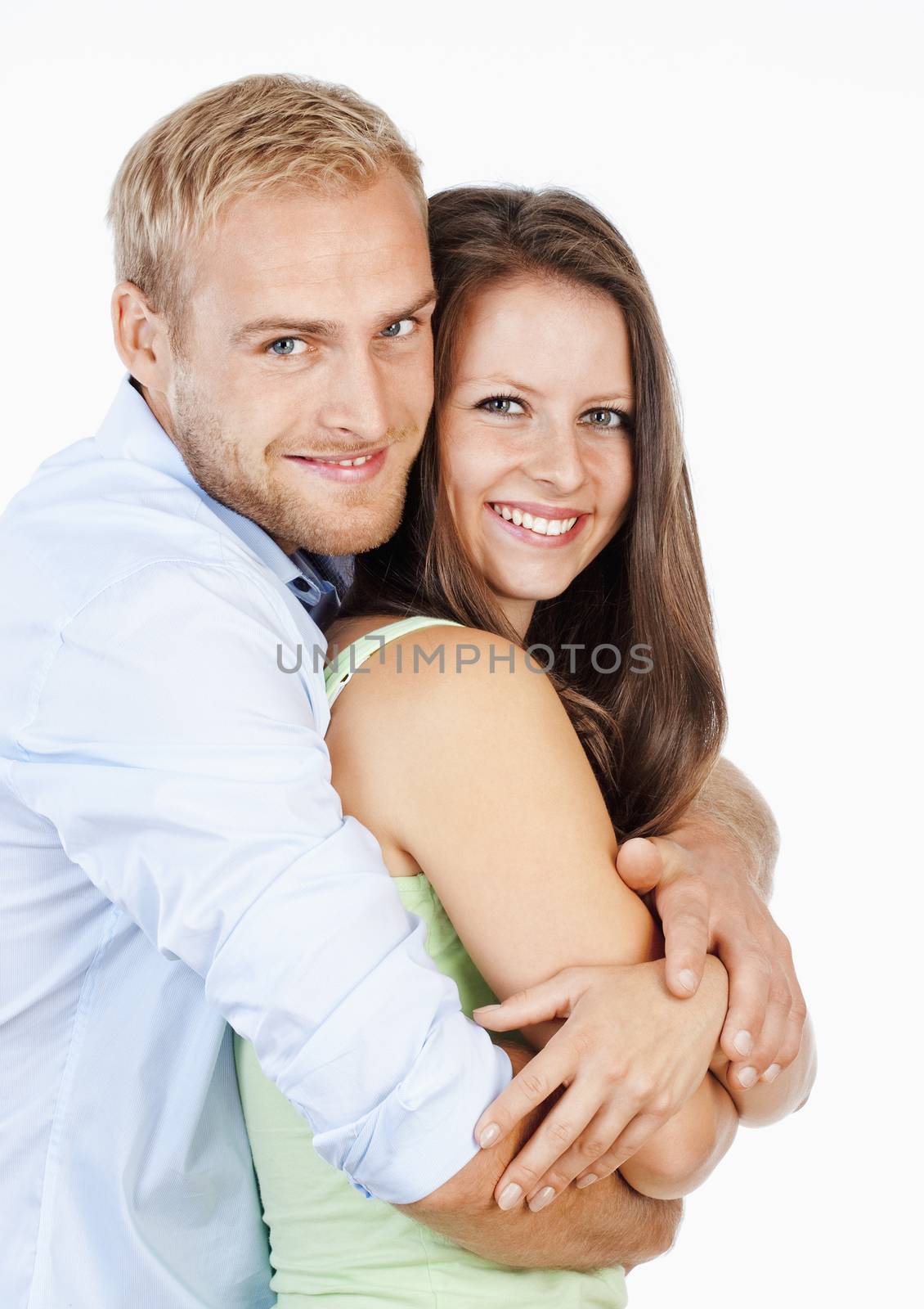 Portrait of a Happy Young Couple Smiling Looking - Isolated on White