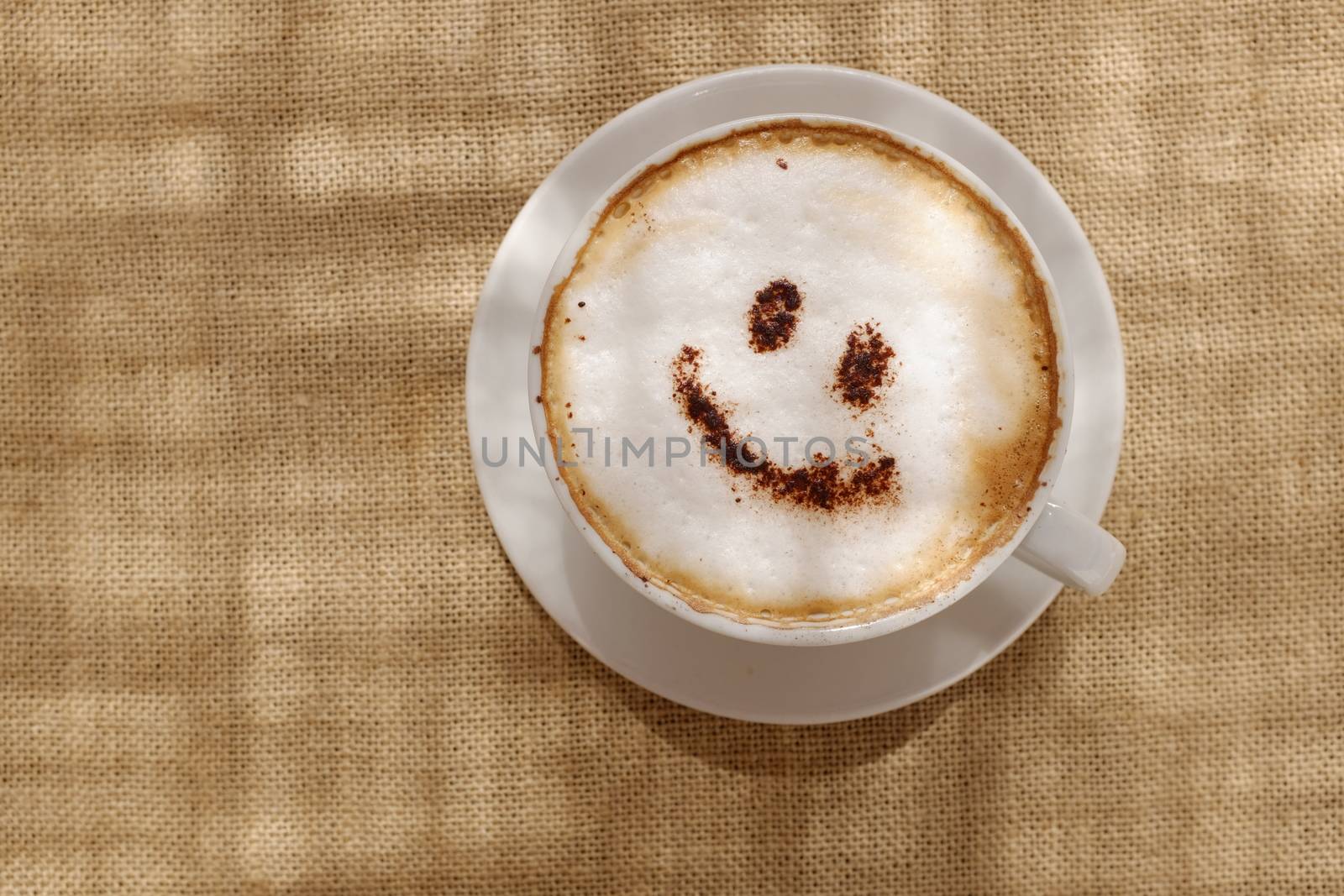 Coffee cappuccino foam or chocolate smiling happy face by alistaircotton