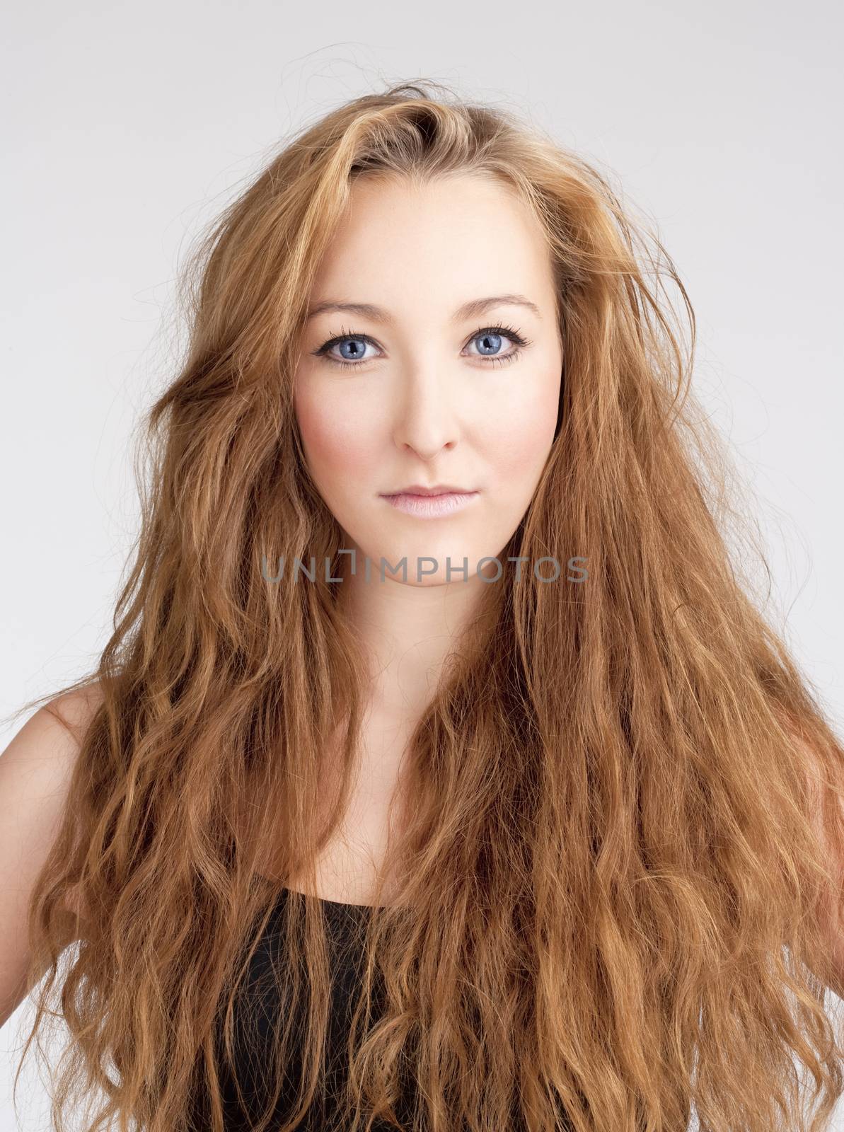 Portrait of a Young Woman with Long Brown Hair and Blue Eyes