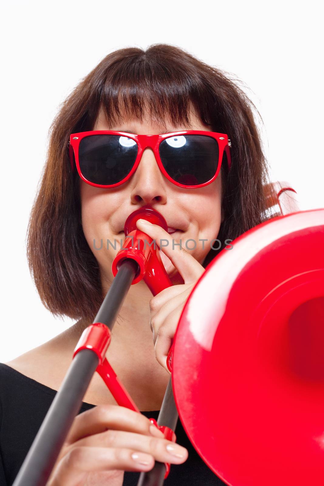 Young Female Musician Playing Trombone - Isolated on White