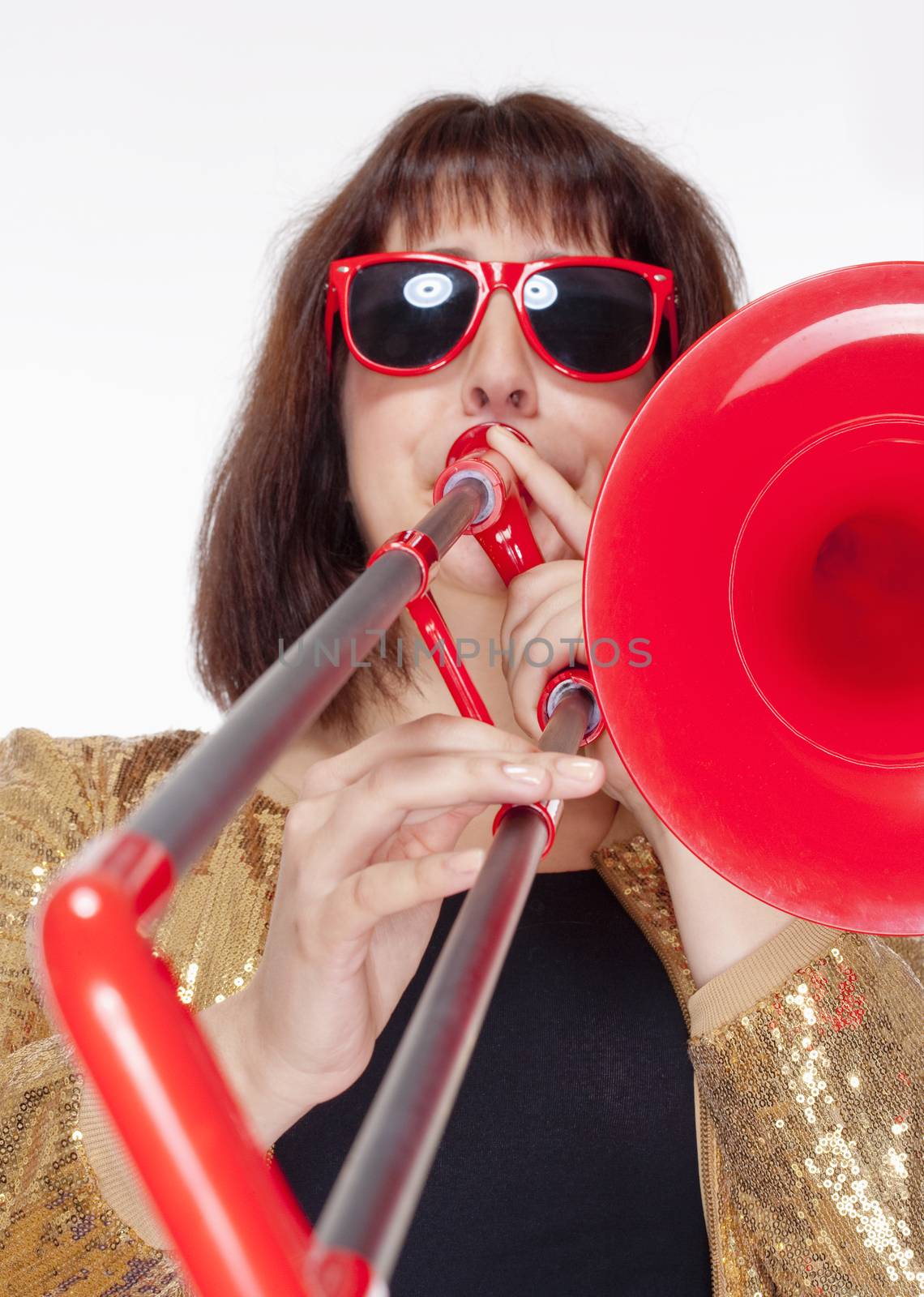 Young Female Musician Playing Trombone - Isolated on White