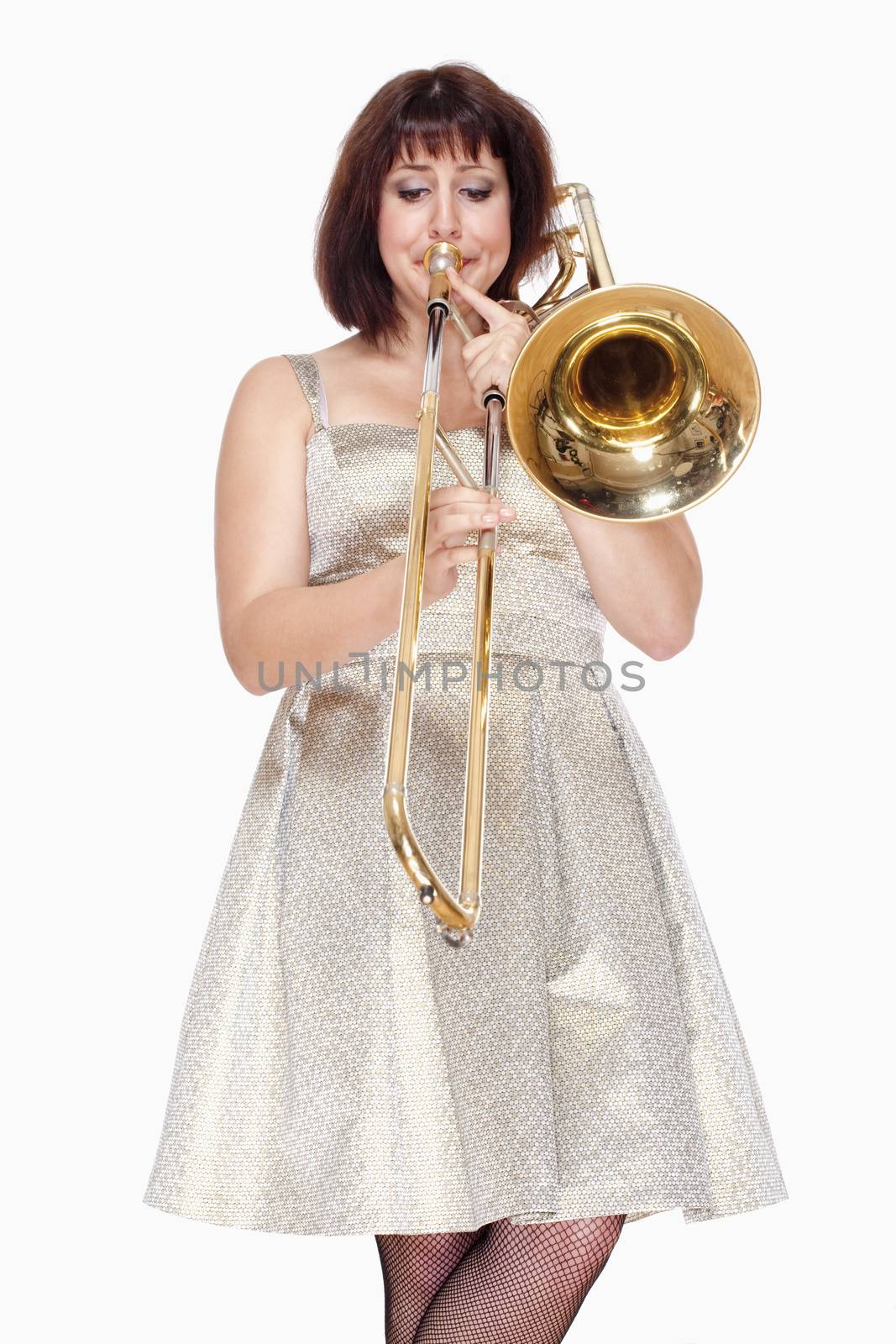 Young Female Musician Playing Trombone by courtyardpix