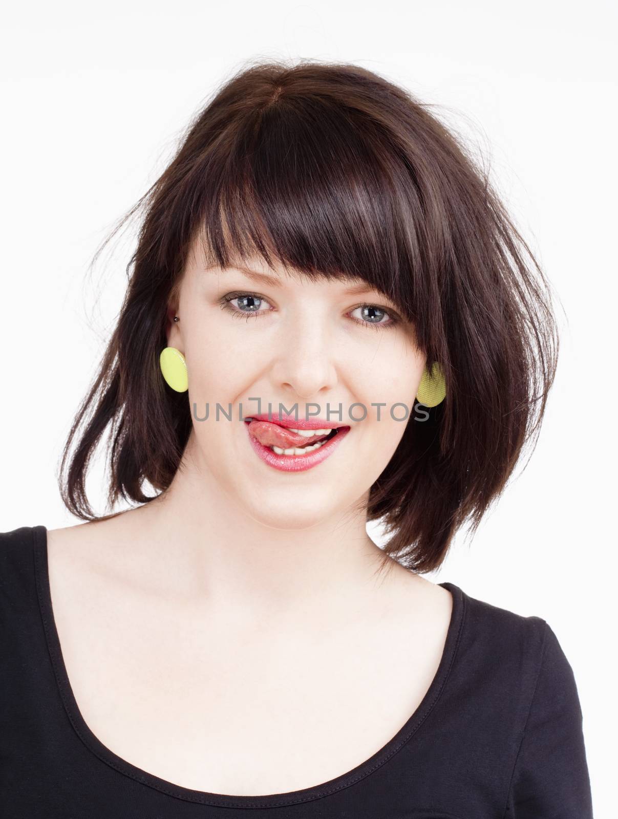 Young Woman with Dark Brown Hair Licking her Lips