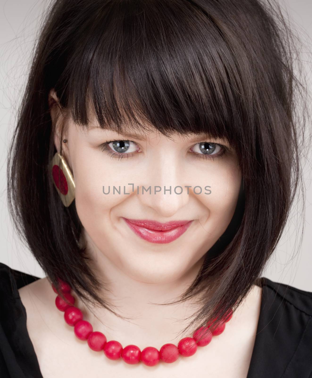 Portrait of a Young Beautiful Woman with Dark Brown Hair Looking