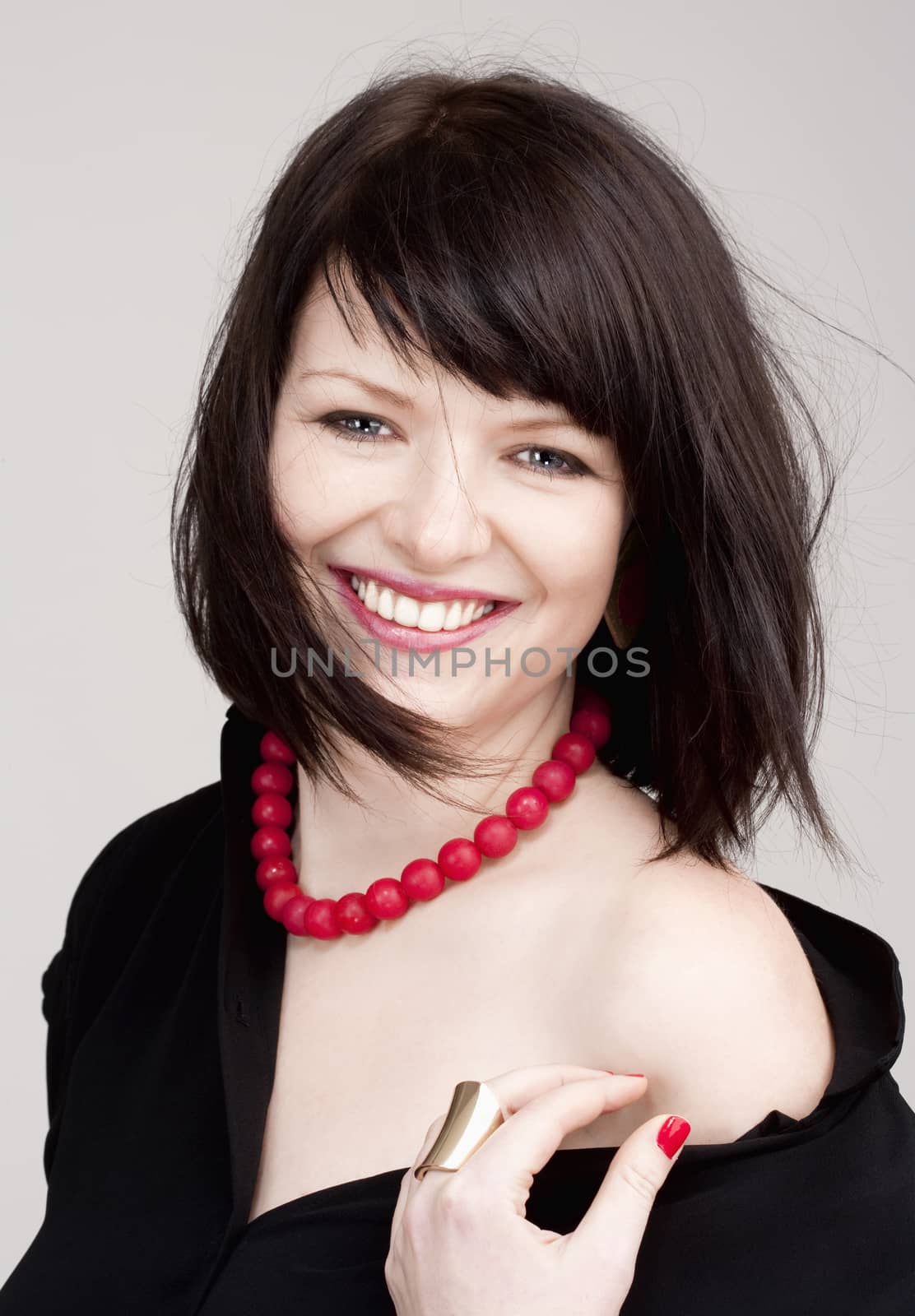 Portrait of a Young Beautiful Woman with Dark Brown Hair Smiling