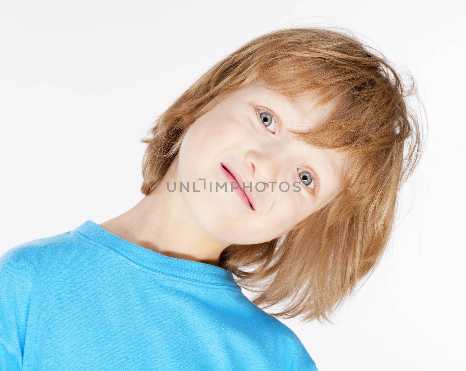 Portrait of a Boy with Blond Hair in Blue Top - Isolated on White