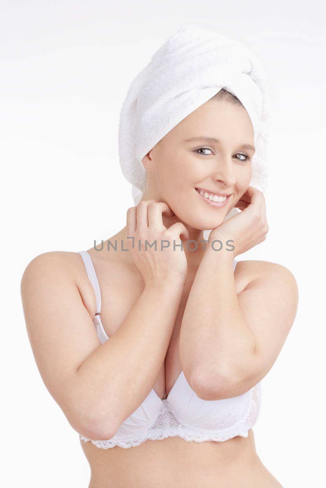 Beautiful Young Woman with Towel on her Head Smiling - Isolated on White