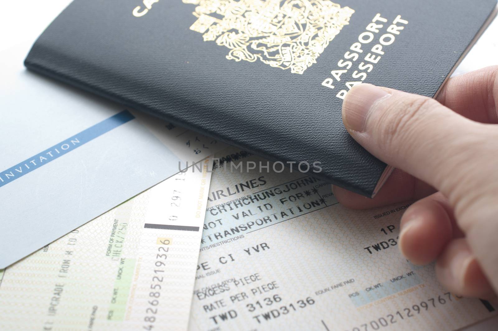 Holding Canada passport with boarding pass