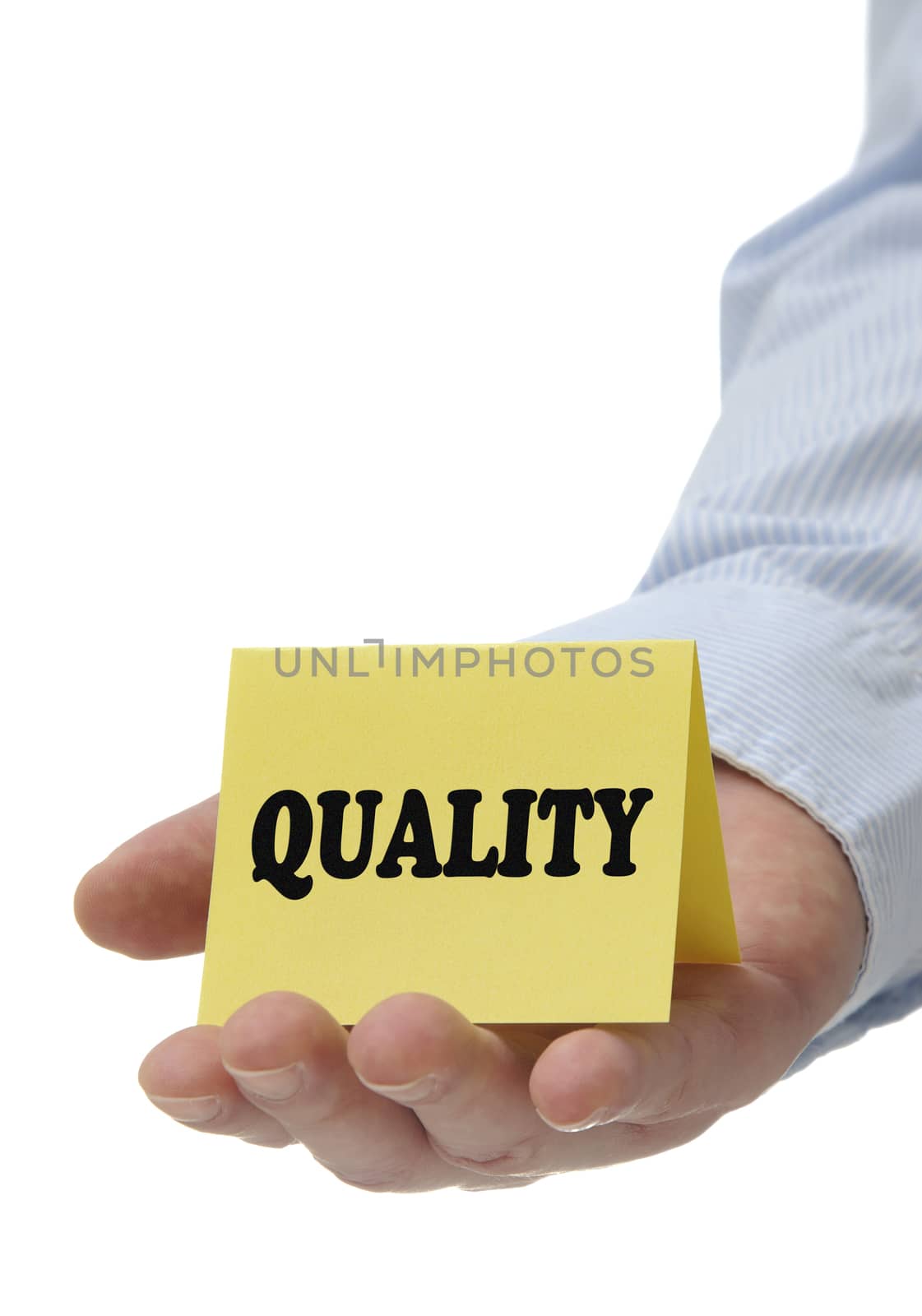 Business man holding yellow quality sign on hand 