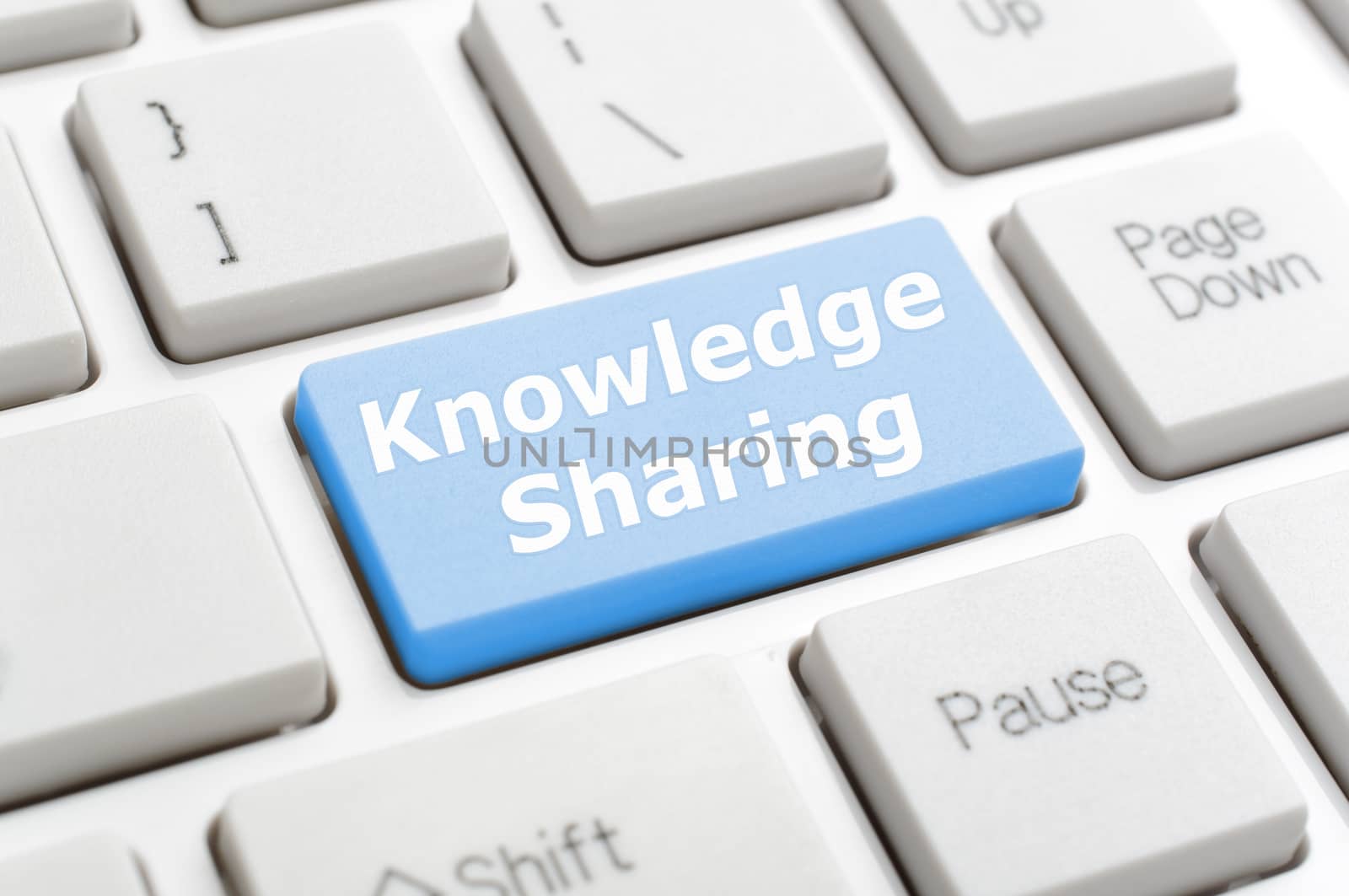 Blue knowledge sharing key on keyboard