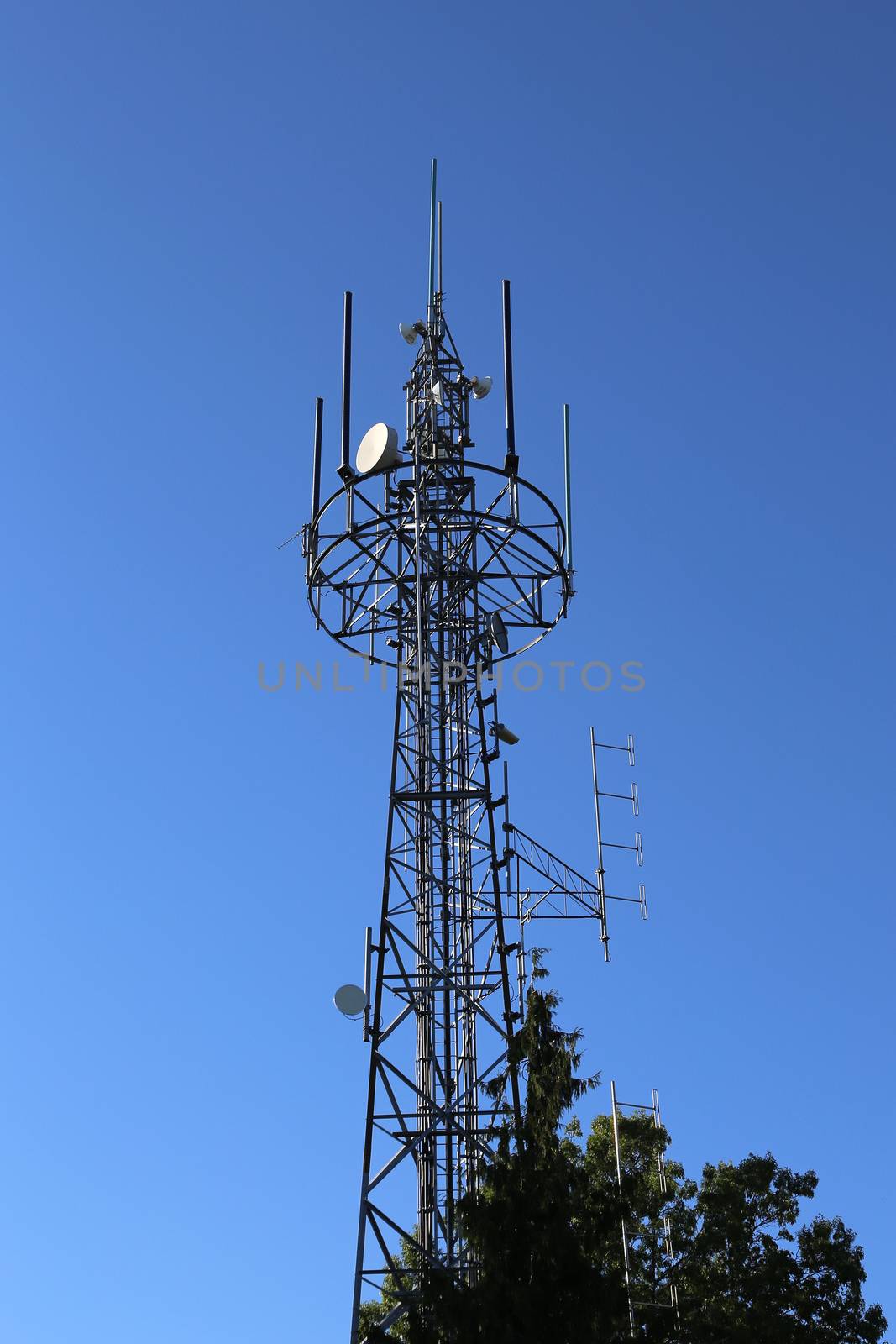 Richmond, BC Canada - September 10, 2014 : Electric high voltage pylon against blue sky in Richmond BC Canada.