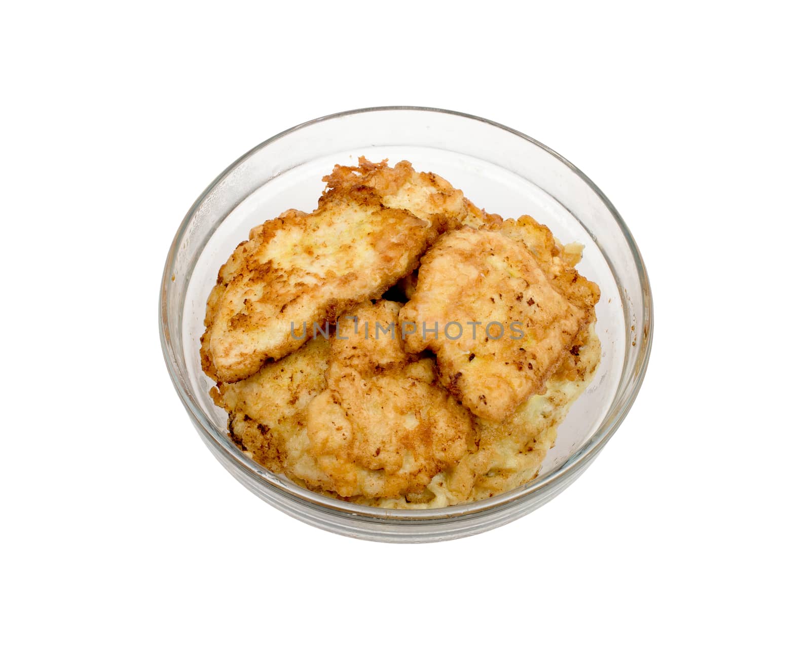 Fried breaded chops in a transparent bowl on a white background