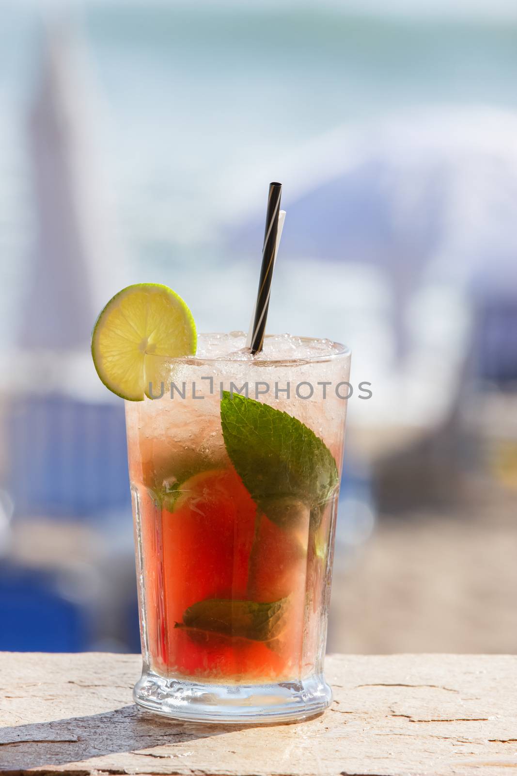Strawberry cocktail on a beach. Outdoor settings