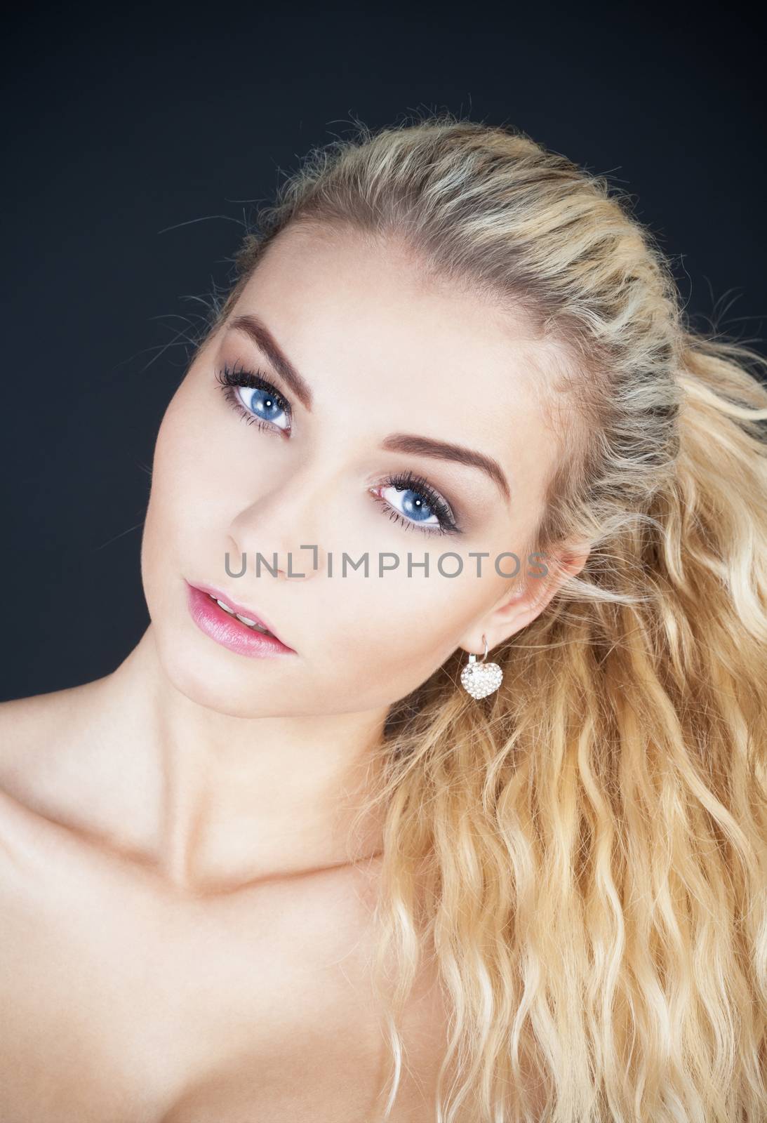 portrait of a young beautiful woman with long blond hair