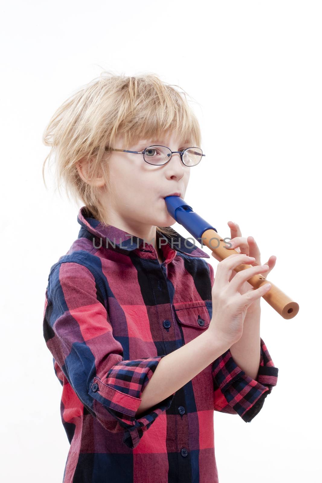 boy with blond hair and glasses playing flute - isolated on white