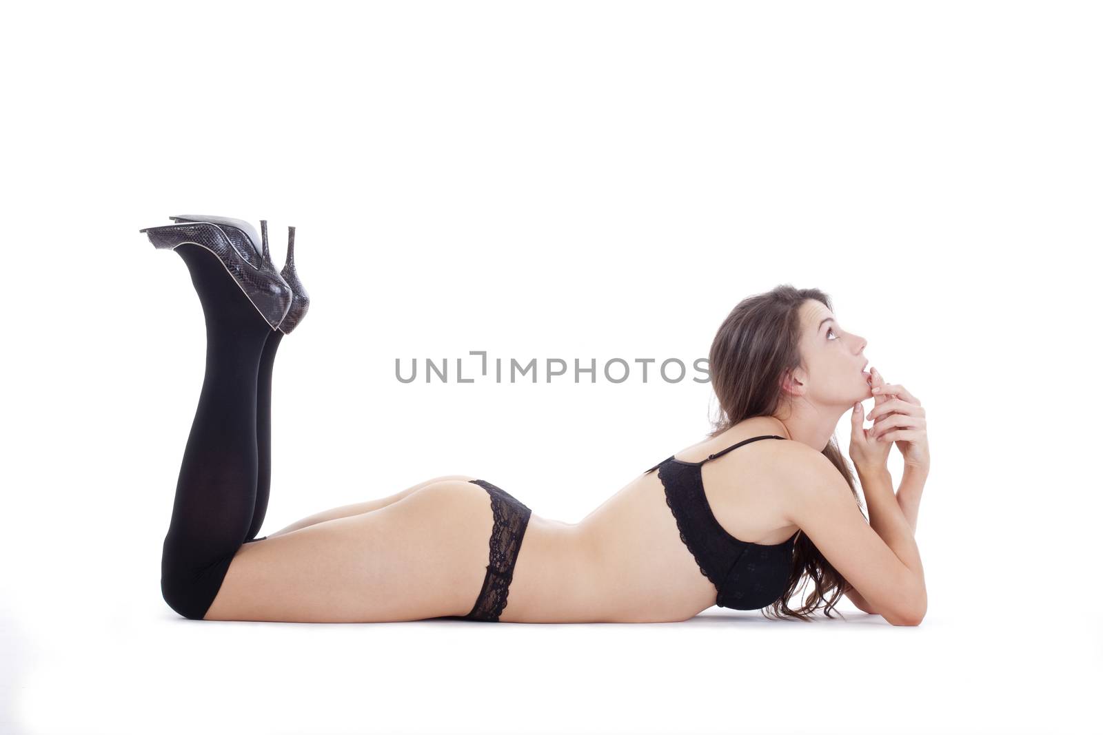 beautiful young woman in black underwear and stockings - isolated on white